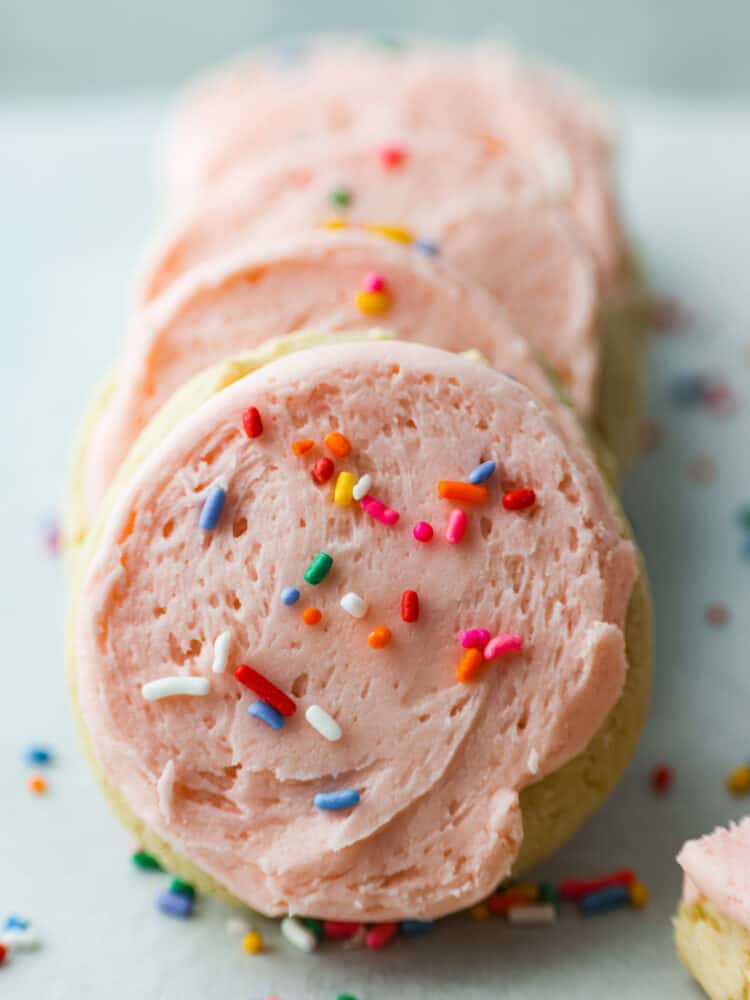 Frosted lofthouse cookies in a line. 