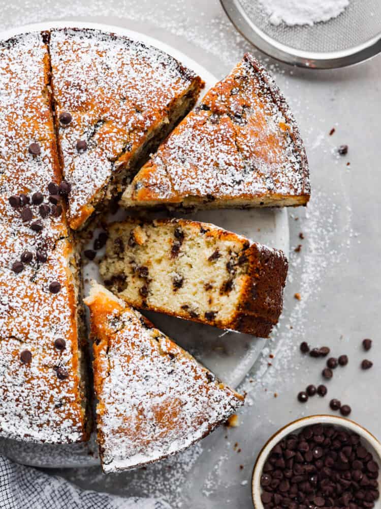 Top-down view of ricotta cake, cut into slices.