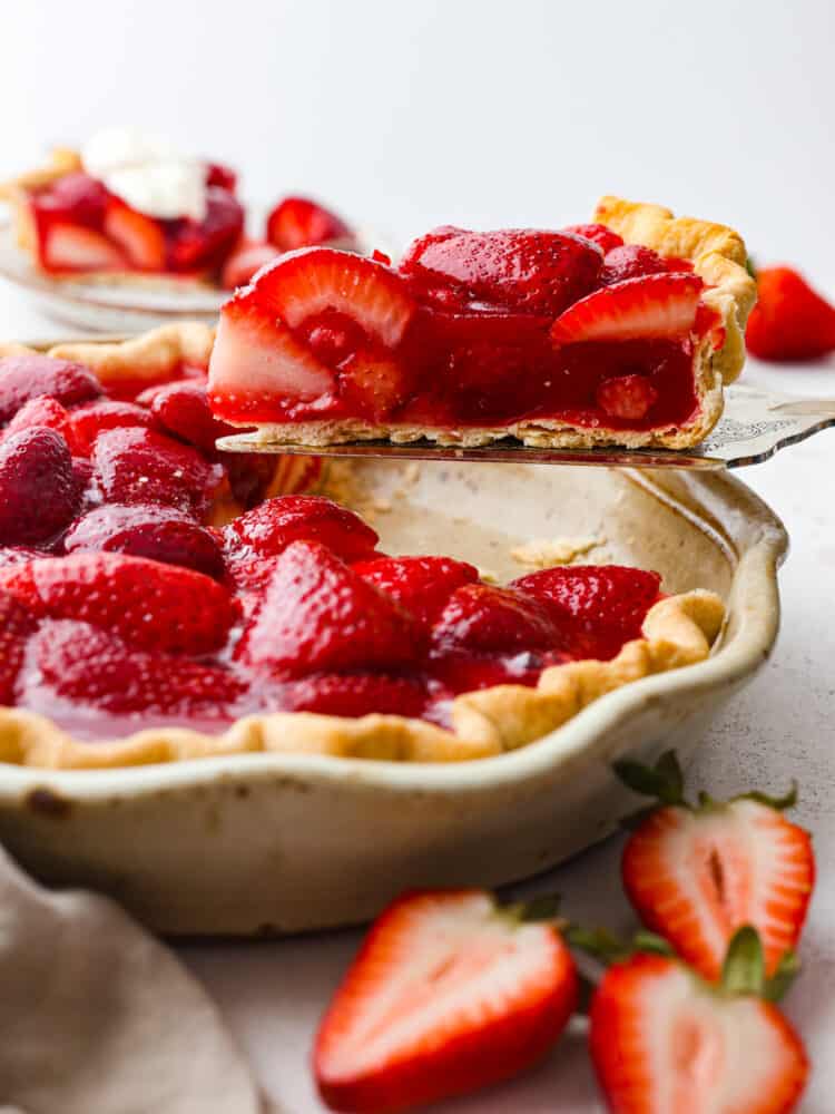 A slice of pie being served with a cake spatula.