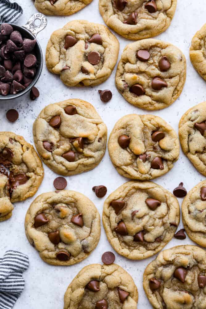 Baked chocolate chip cookies on a counter. 