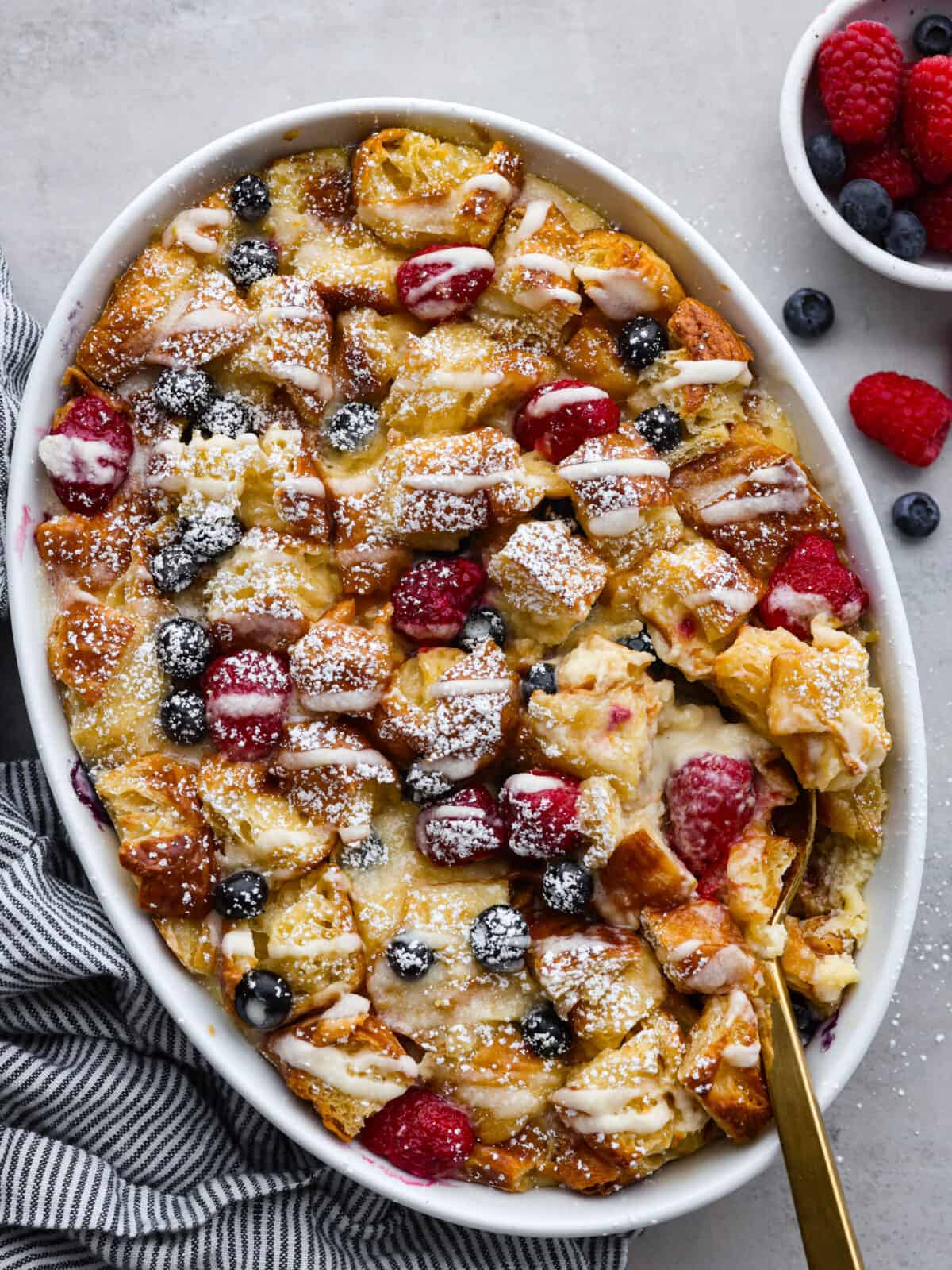 Top-down view of a cooked croissant breakfast casserole.