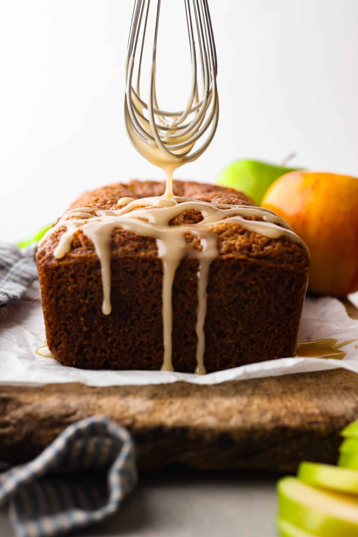 Front view of apple bread, topped with a sweet glaze.