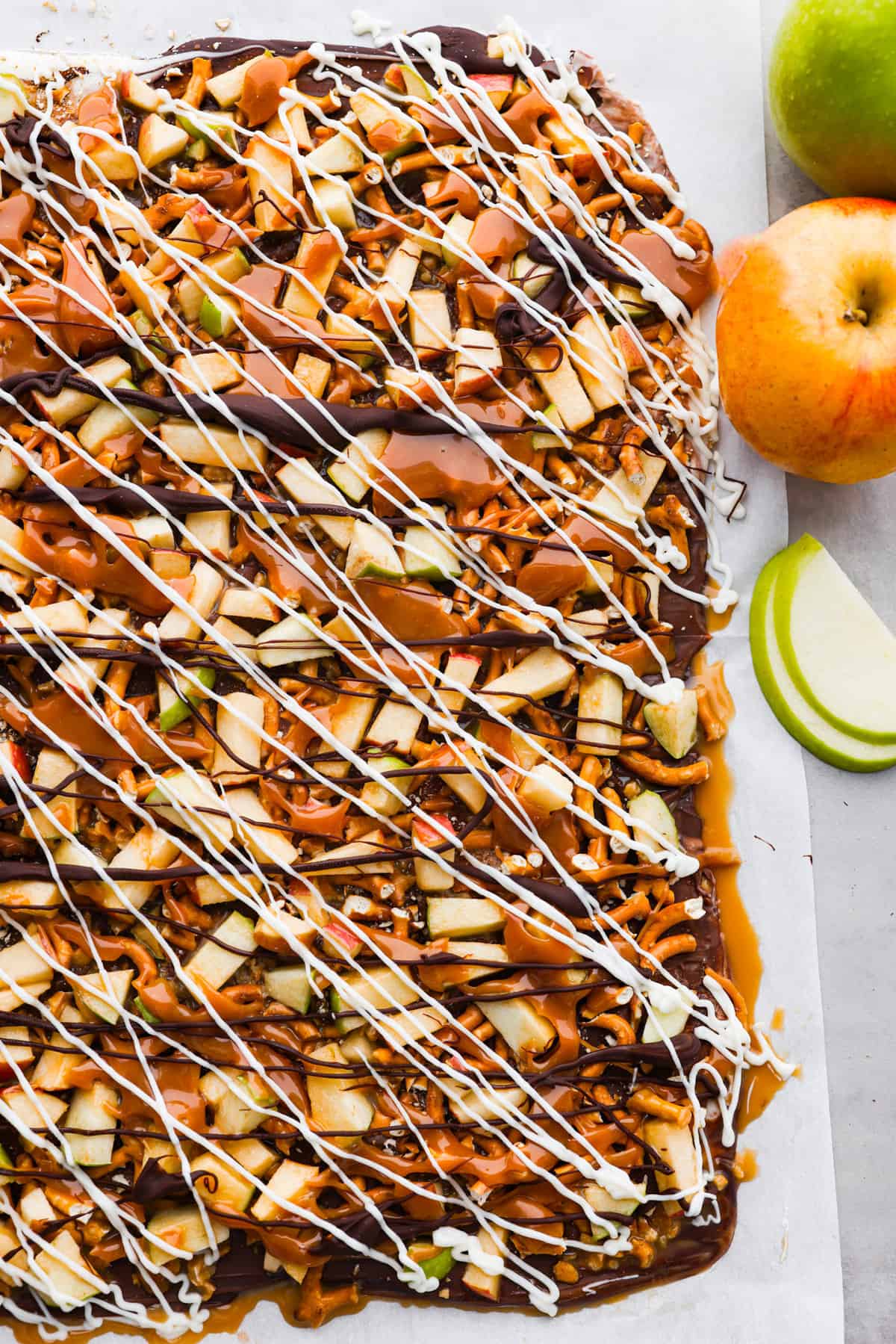 Top-down view of caramel apple bark that hasn't been broken into pieces yet.