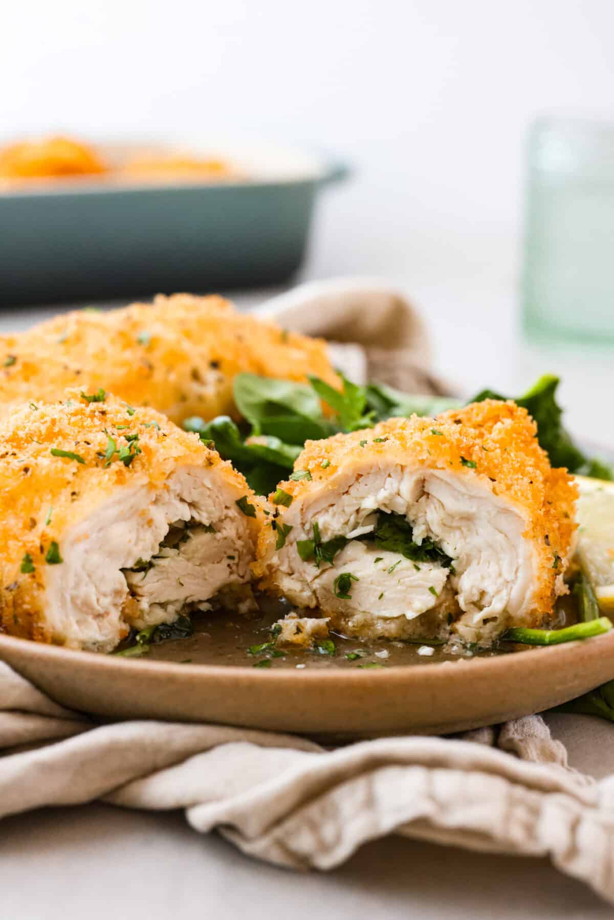 A piece of chicken Kiev, cut in half.