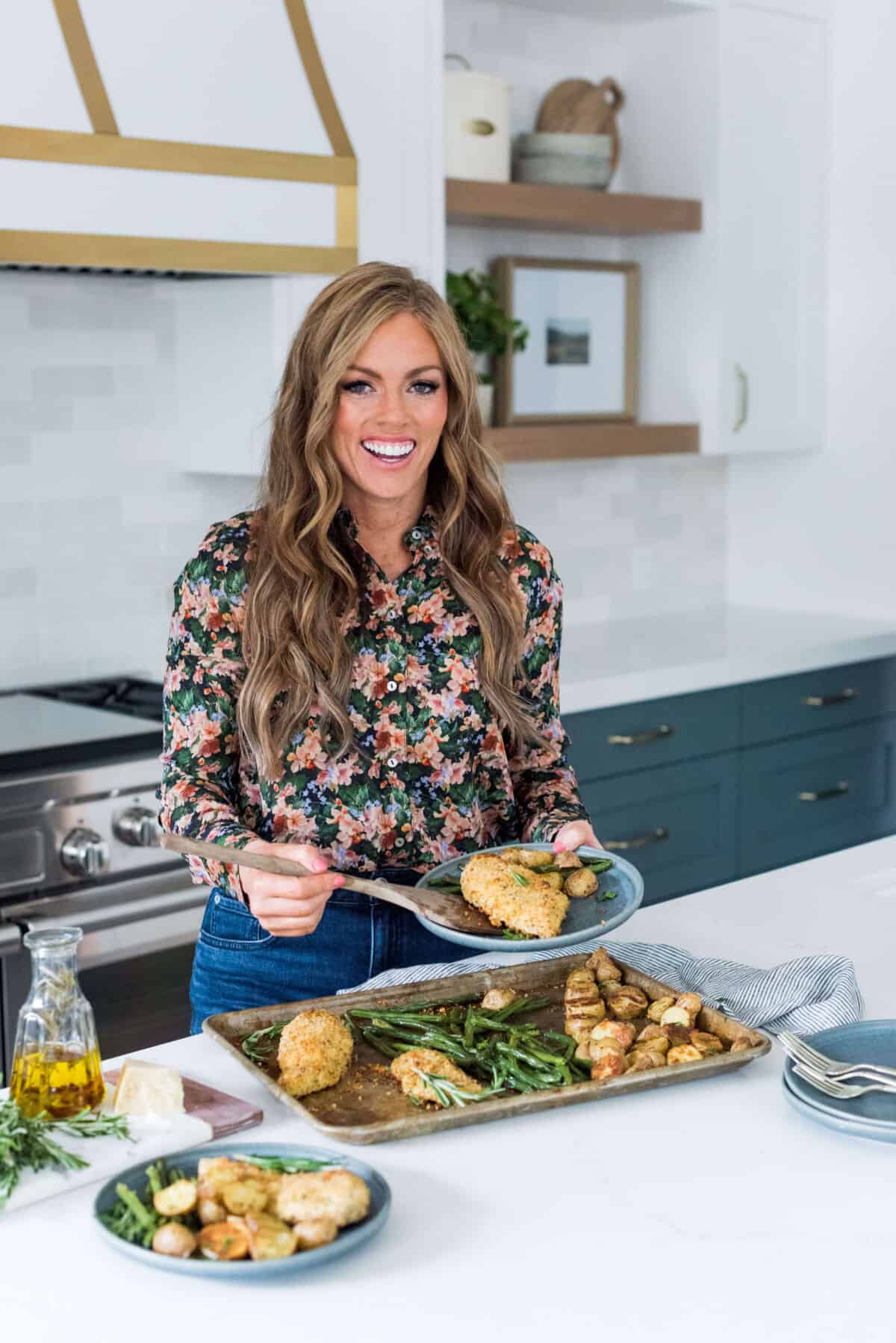 Alyssa Rivers cooking chicken in her kitchen. 