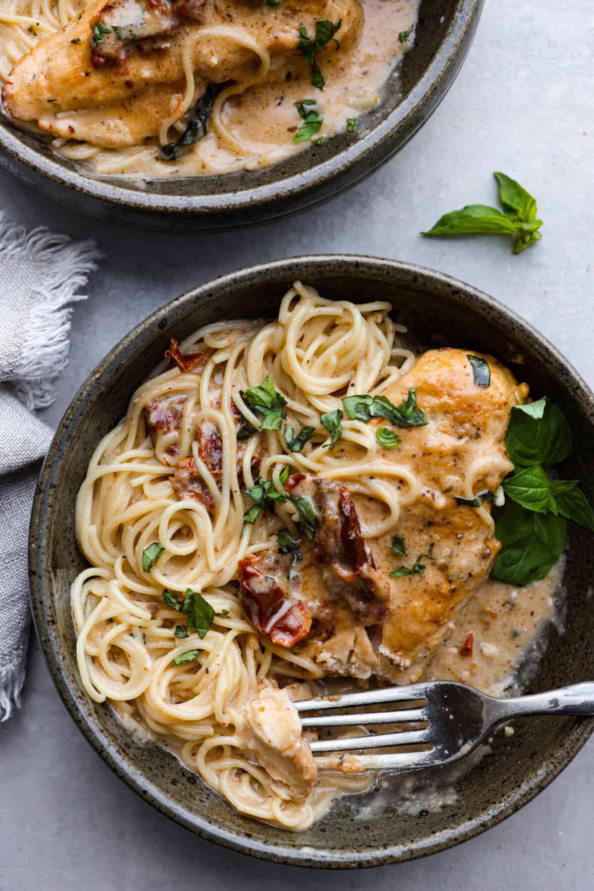 Crock Pot Marry Me Chicken served over spaghetti noodles.