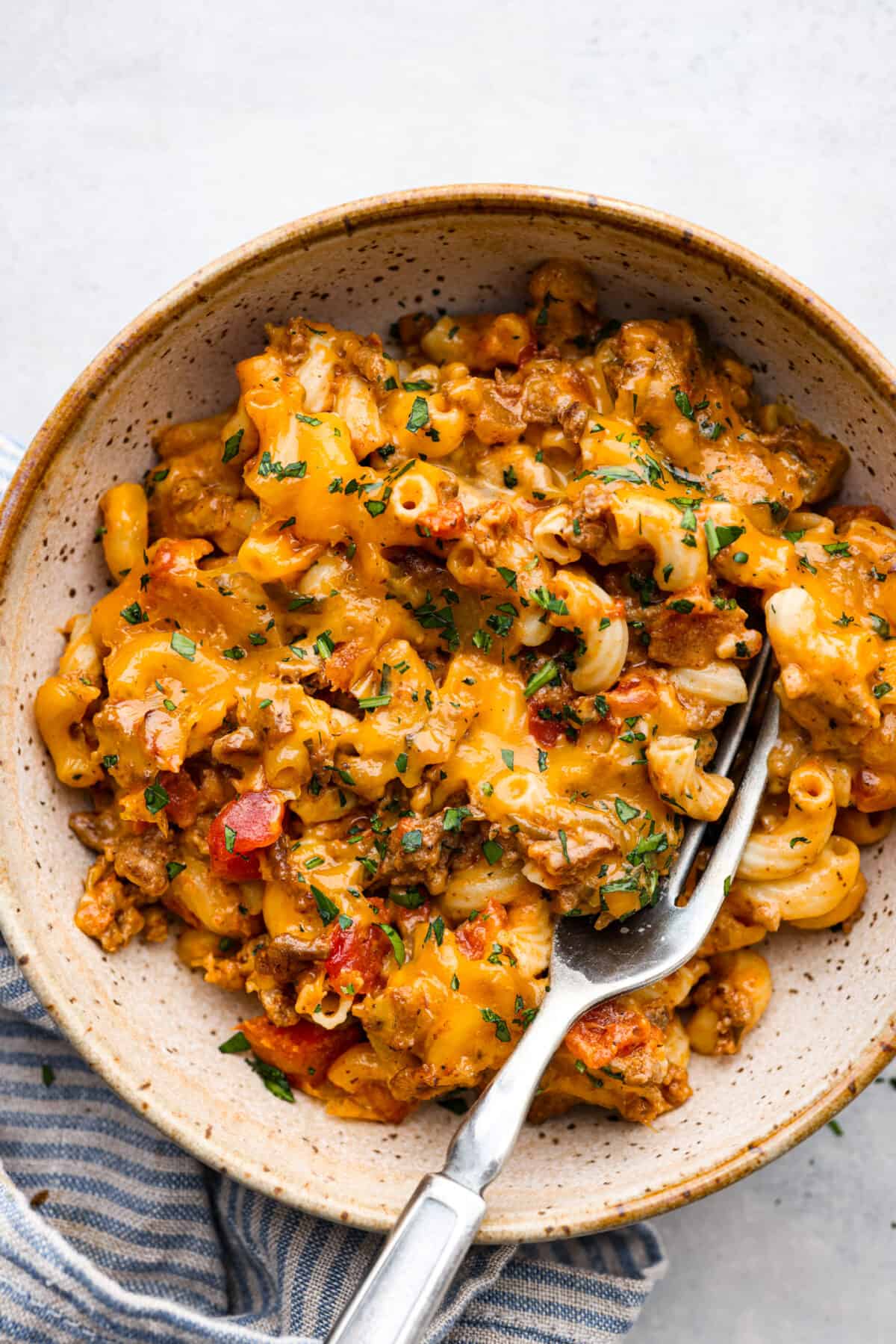 Cheeseburger casserole served in a stoneware dish.