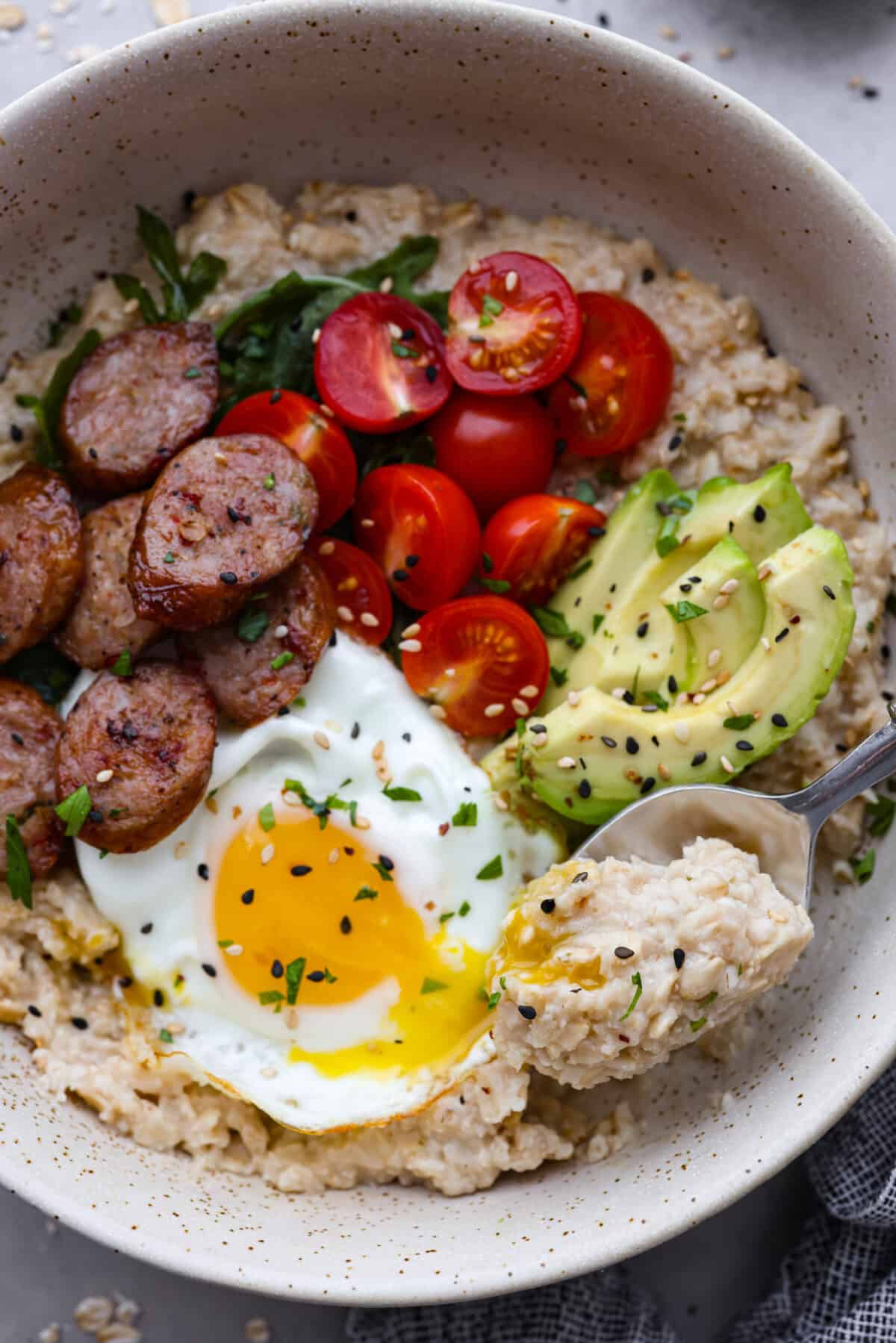 The top view of a bowl of savory oatmeal. 