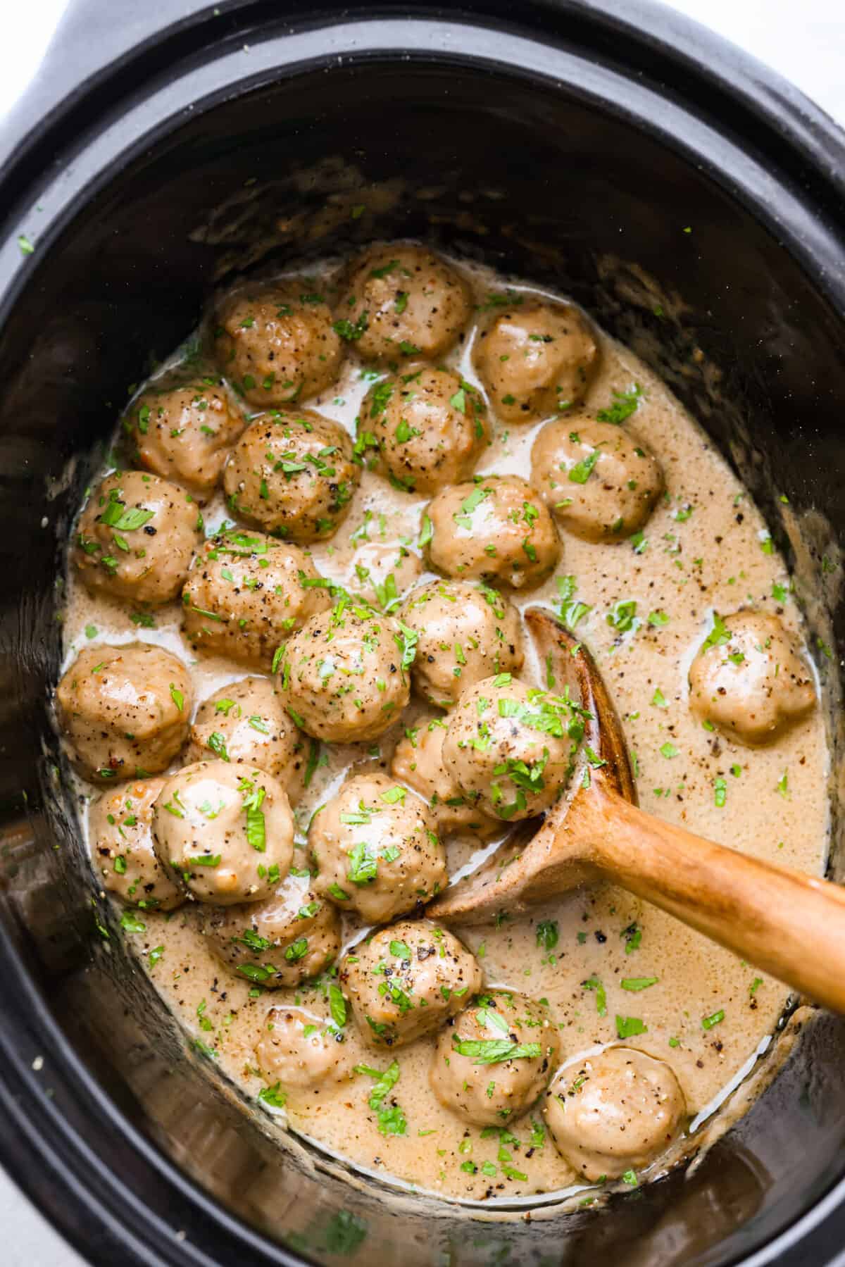 Overhead shot of slow cooker Swedish meatballs. 