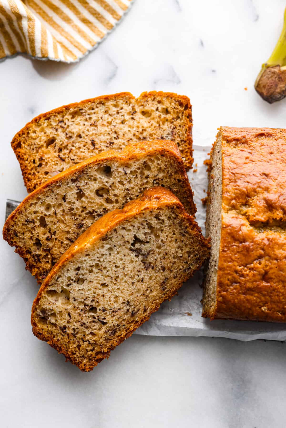 Sour cream banana bread, cut into 3 slices.