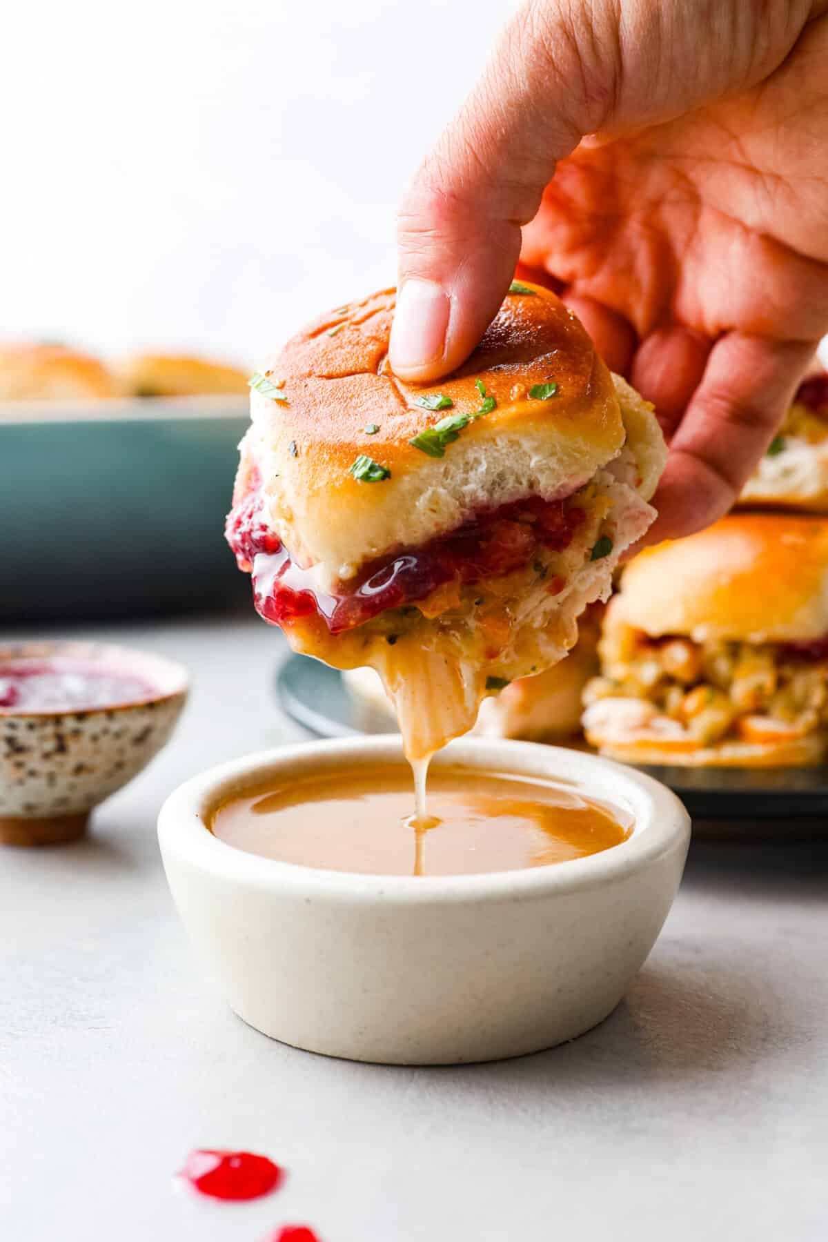 Dipping a slider into gravy.