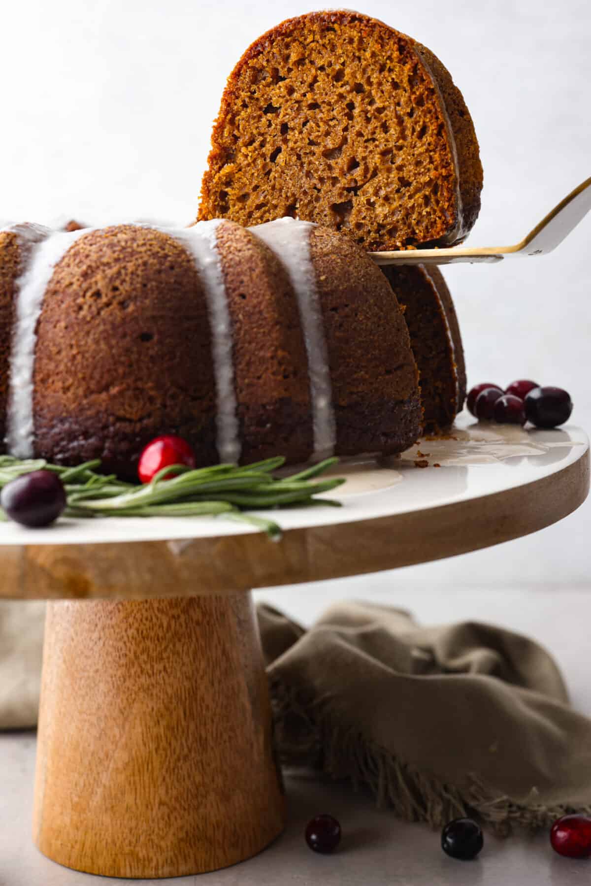 A slice of cake being served with a metal spatula.