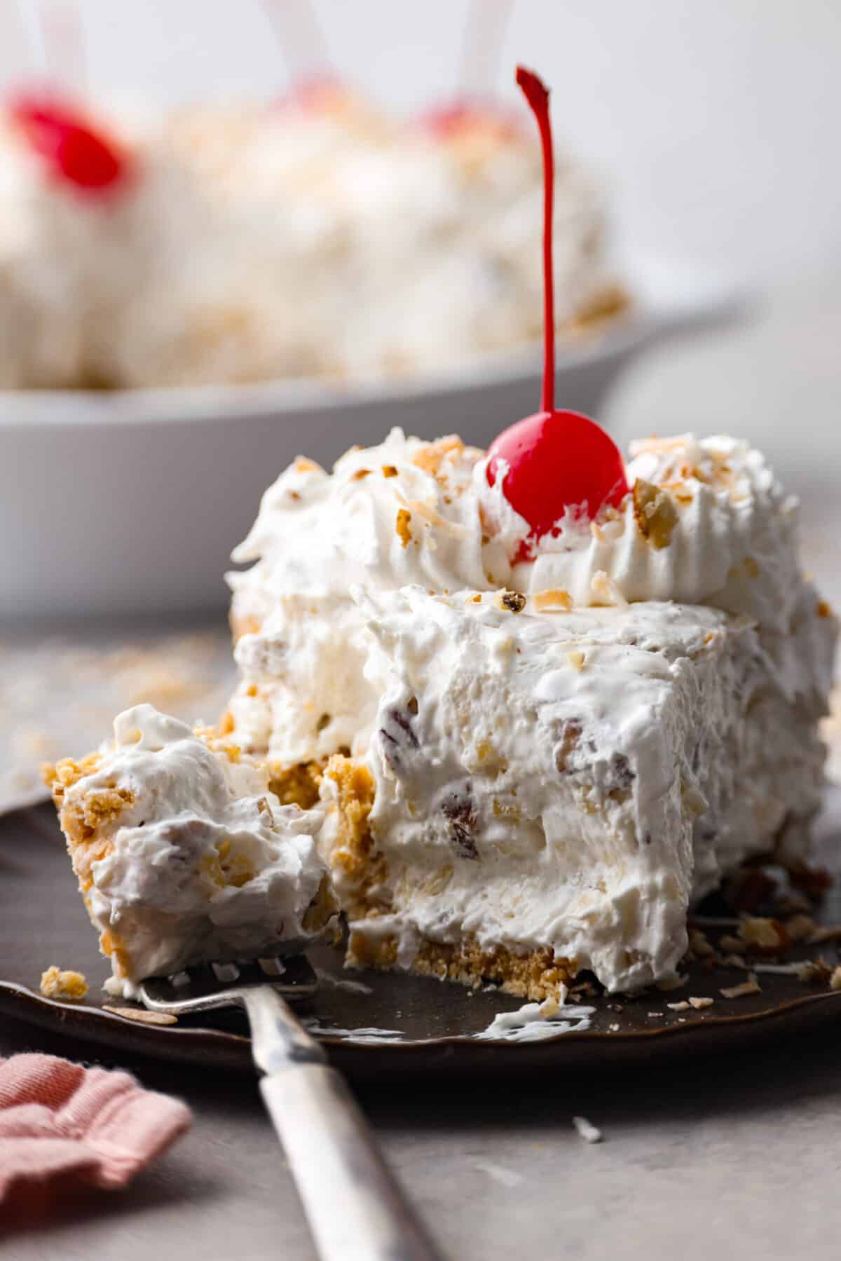 Closeup of a slice of pie with a bite taken out of it.