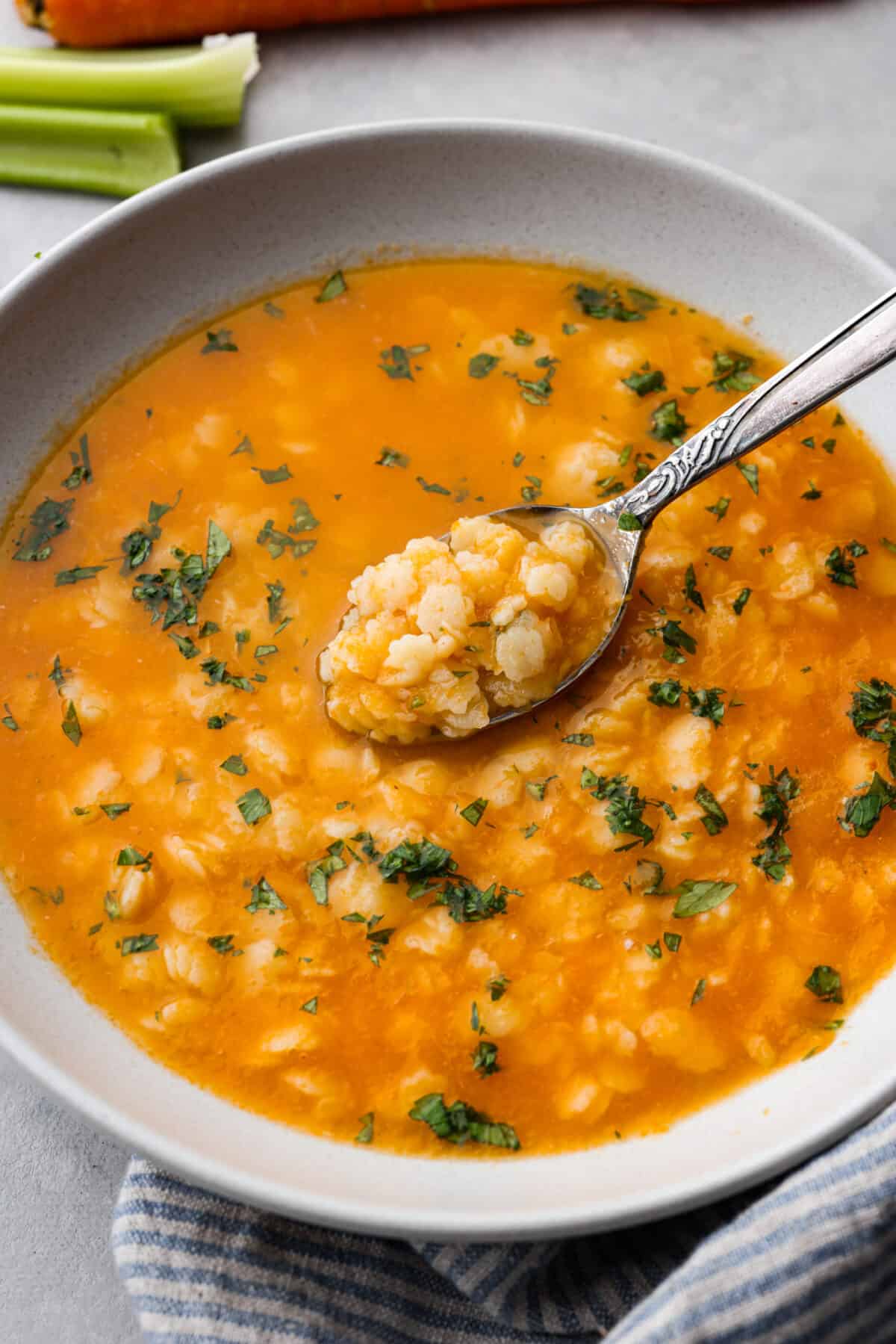 A spoonful of pastina in a metal spoon.