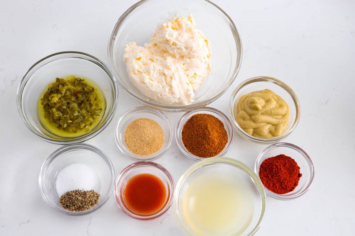 All of the different sauce ingredients in small glass bowls.