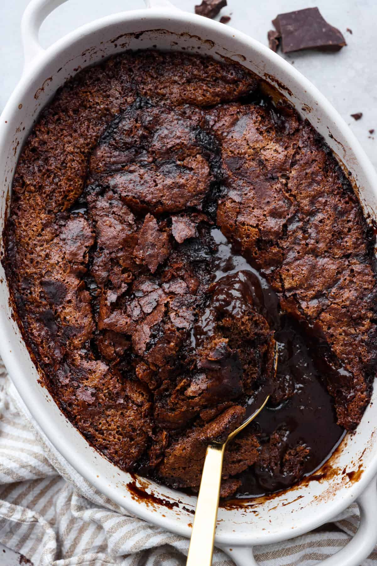 The top view of chocolate cobbler in an oval baking dish. 