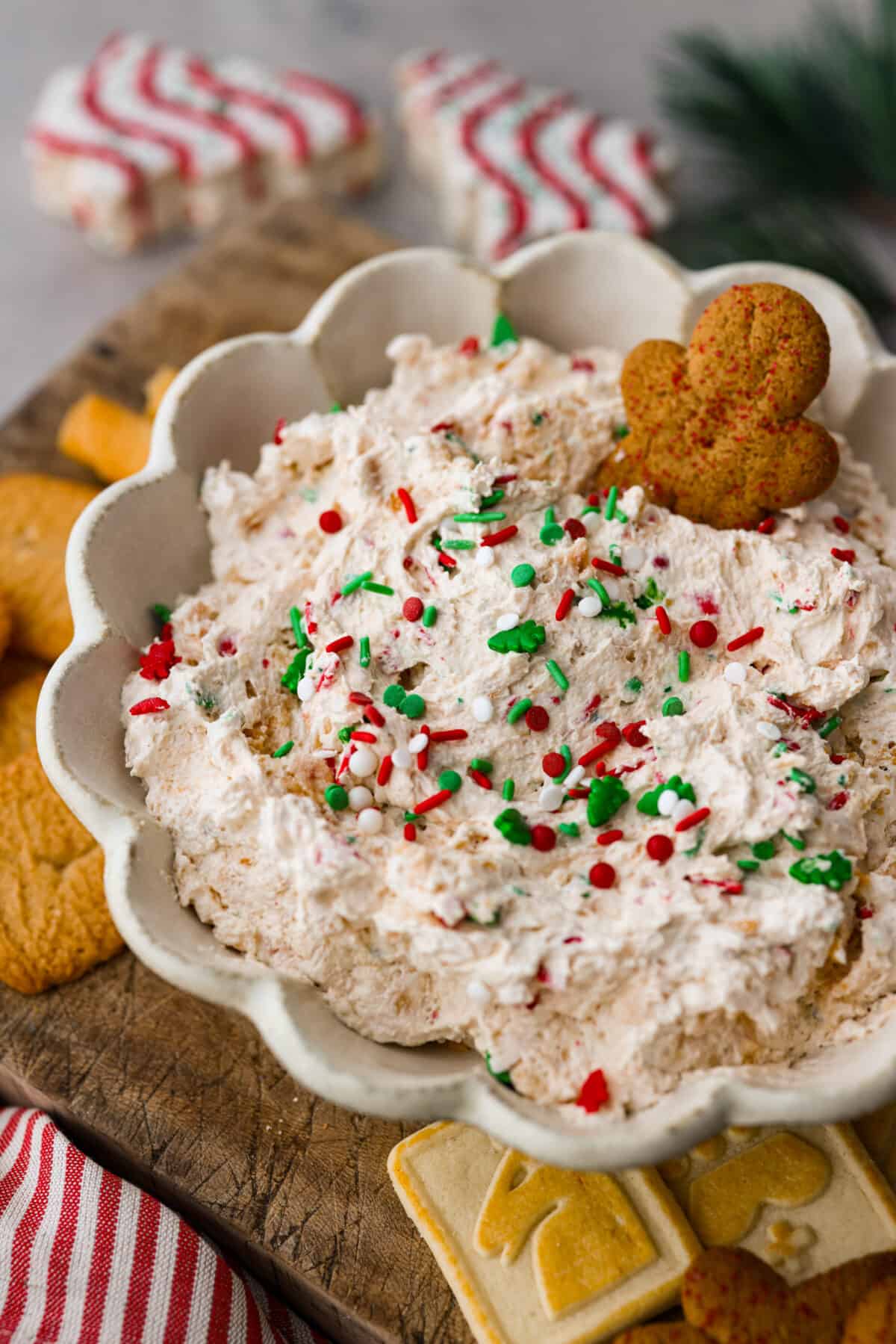 Closeup of Little Debbie Christmas Tree Dip with a gingerbread cookie stuck in it.