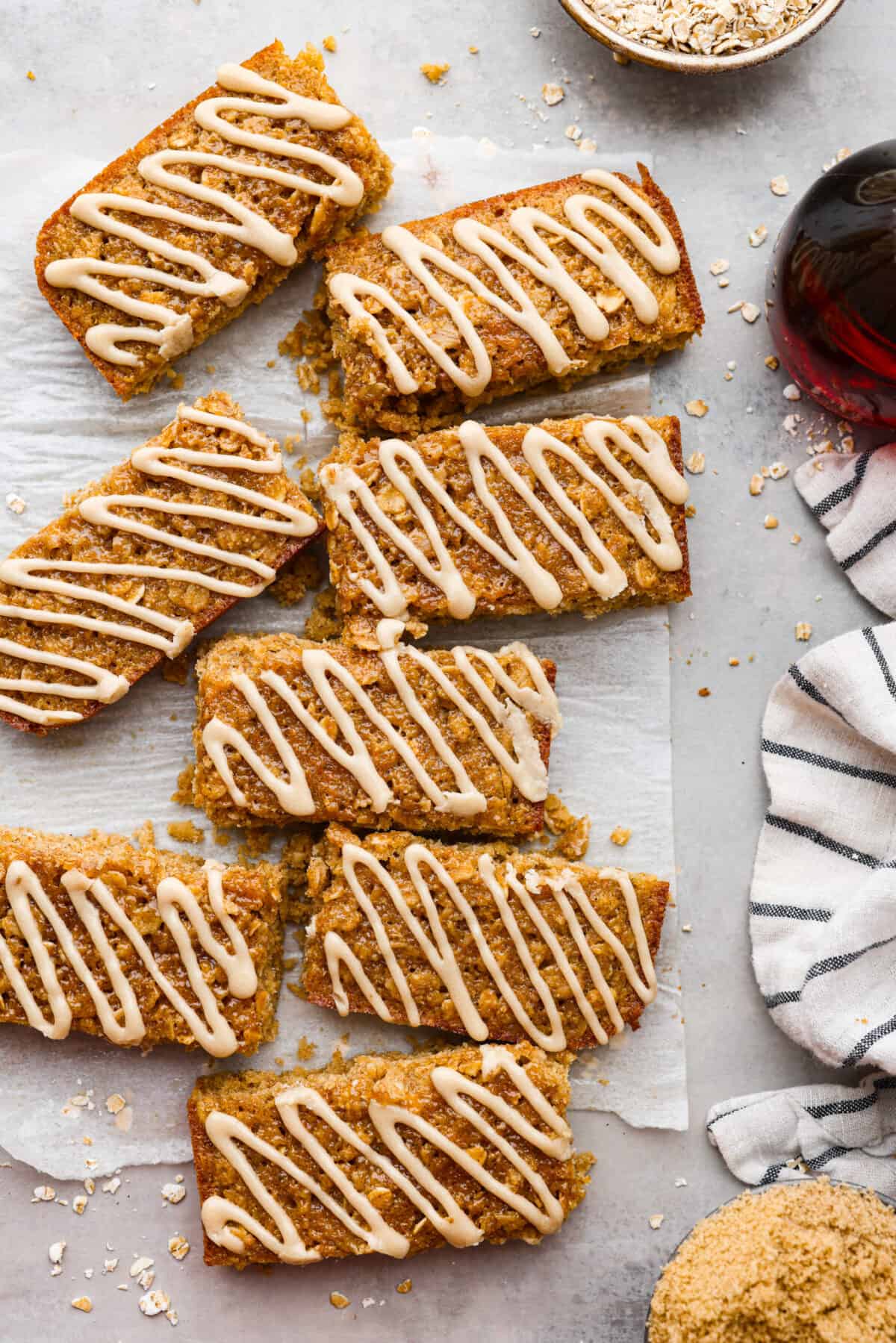 Breakfast bars on some parchment paper on the countertop. 