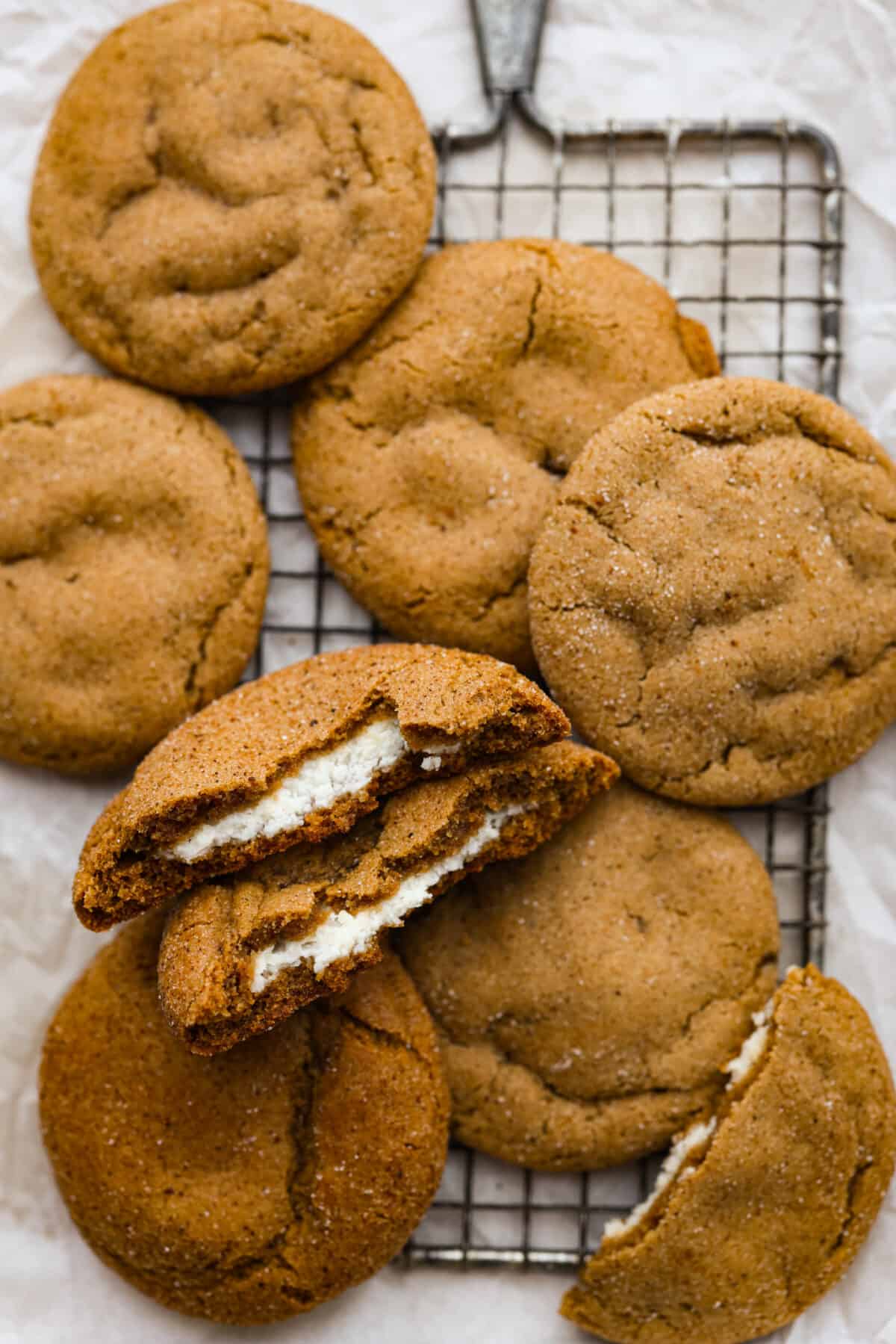 Cheesecake stuffed gingerbread cookies on a wire rack.