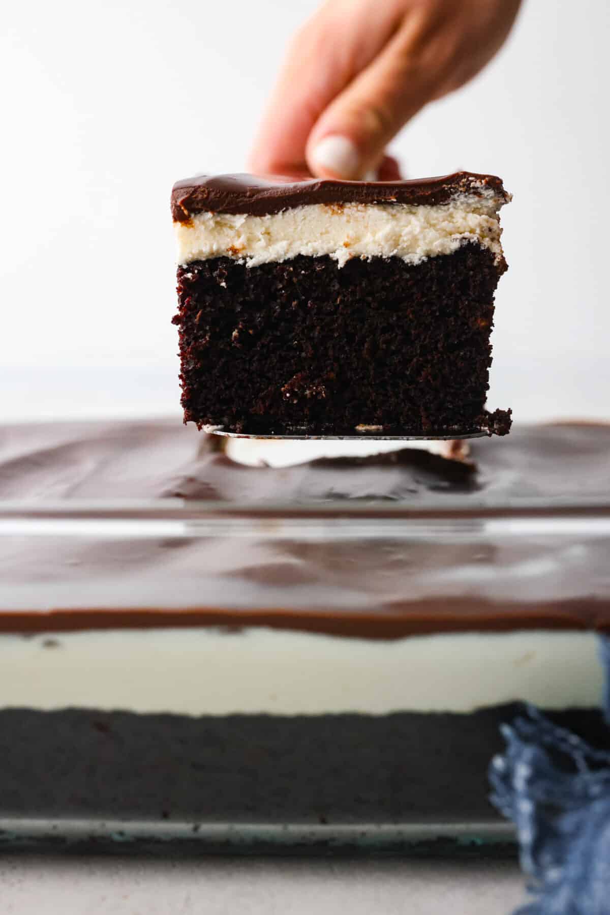 Close view of a spatula lifting up a slice of ho ho cake.