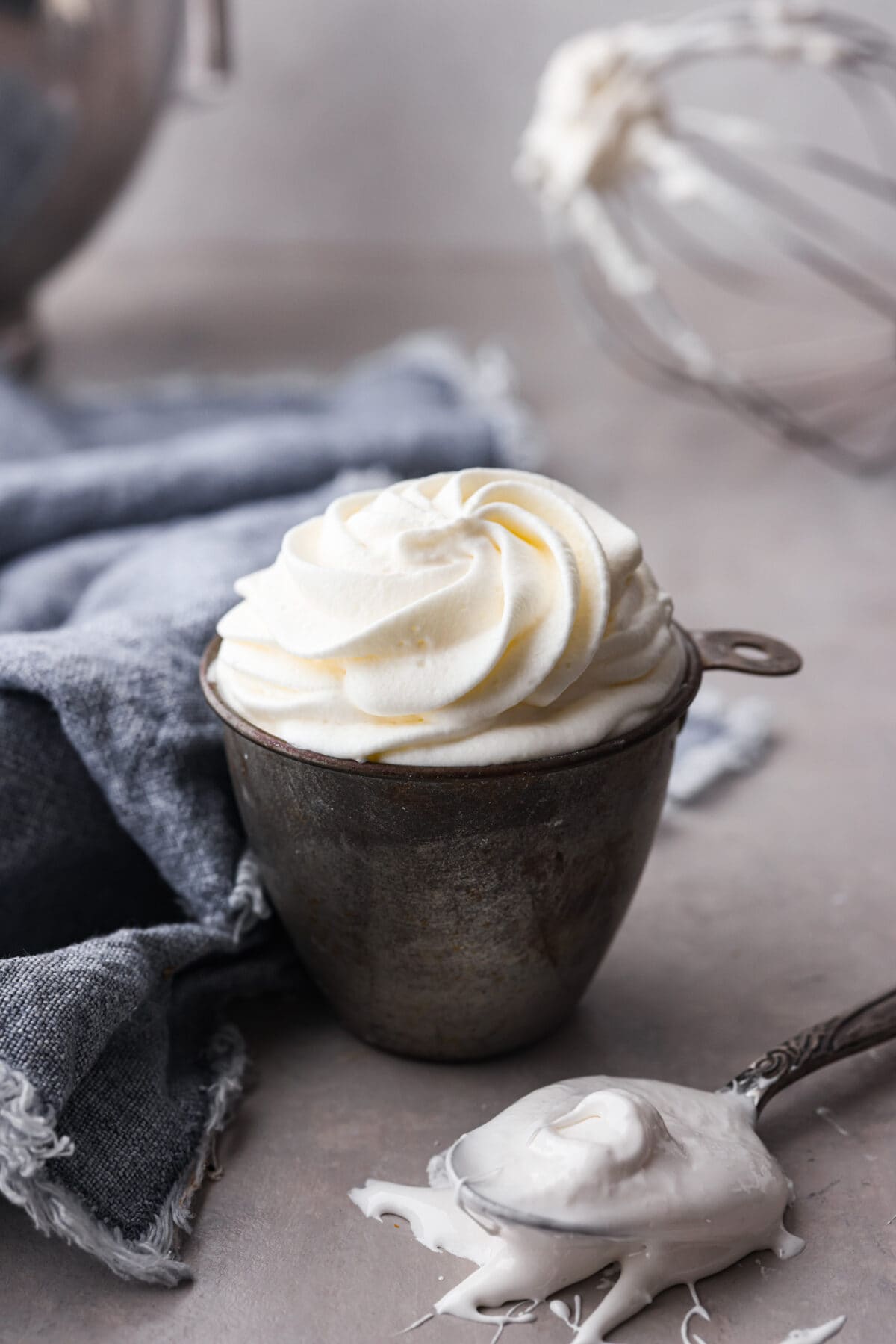 Marshmallow whipped cream in a measuring cup.