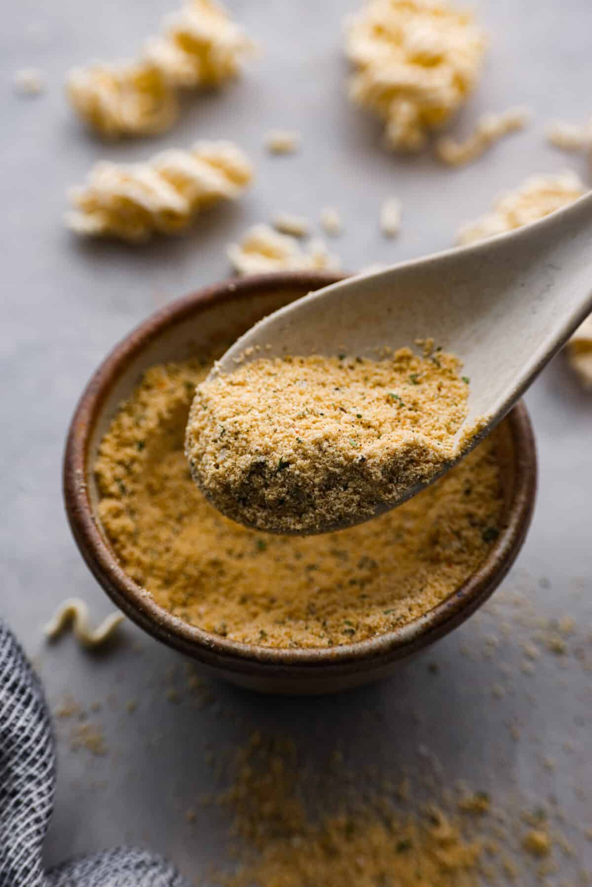 Closeup of a spoonful of ramen seasoning.