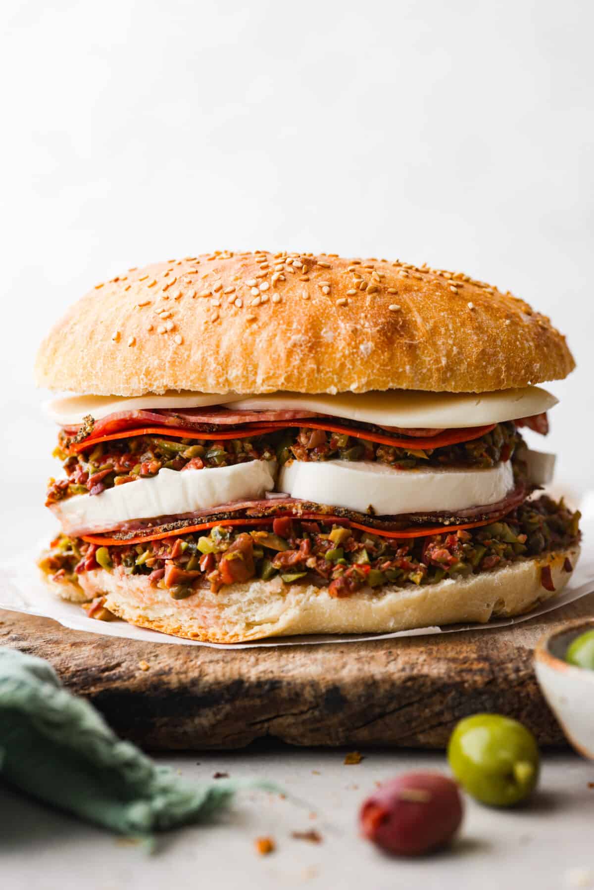 Hero image of a muffuletta sandwich.