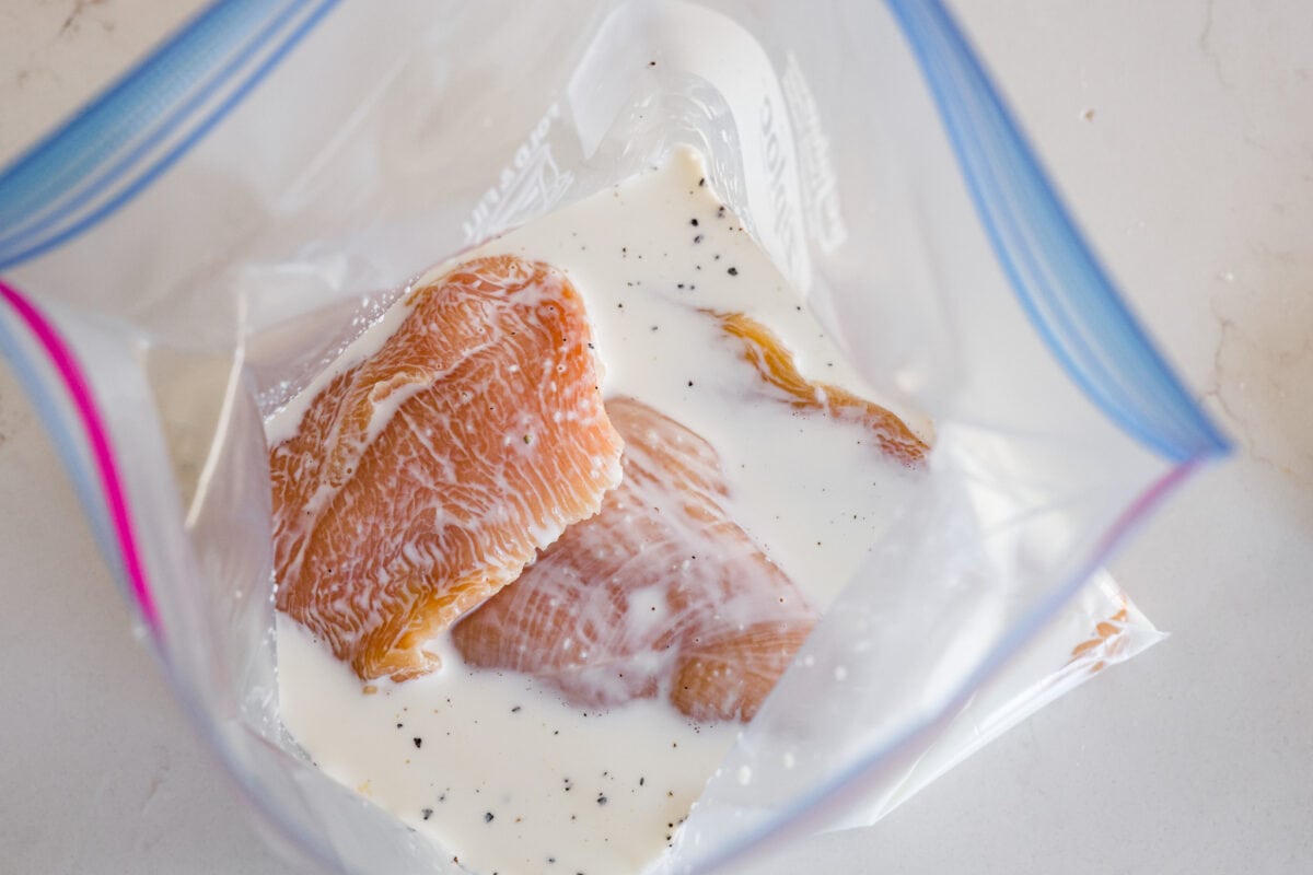 The chicken breasts being marinated.