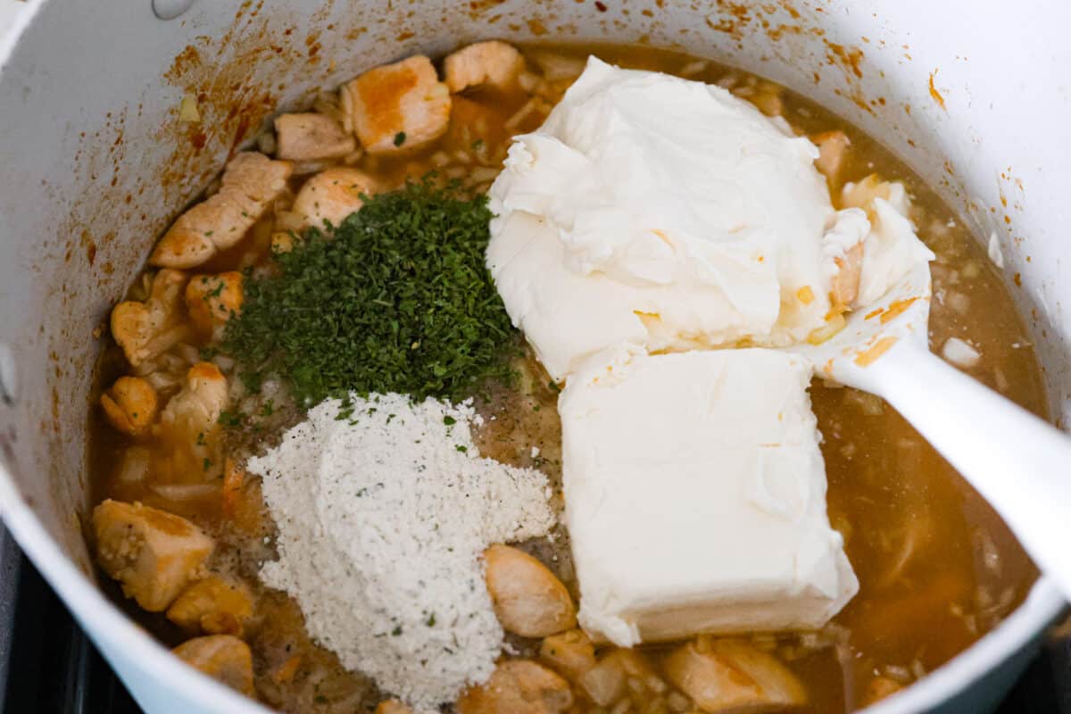 The crack chicken sauce ingredients being added.