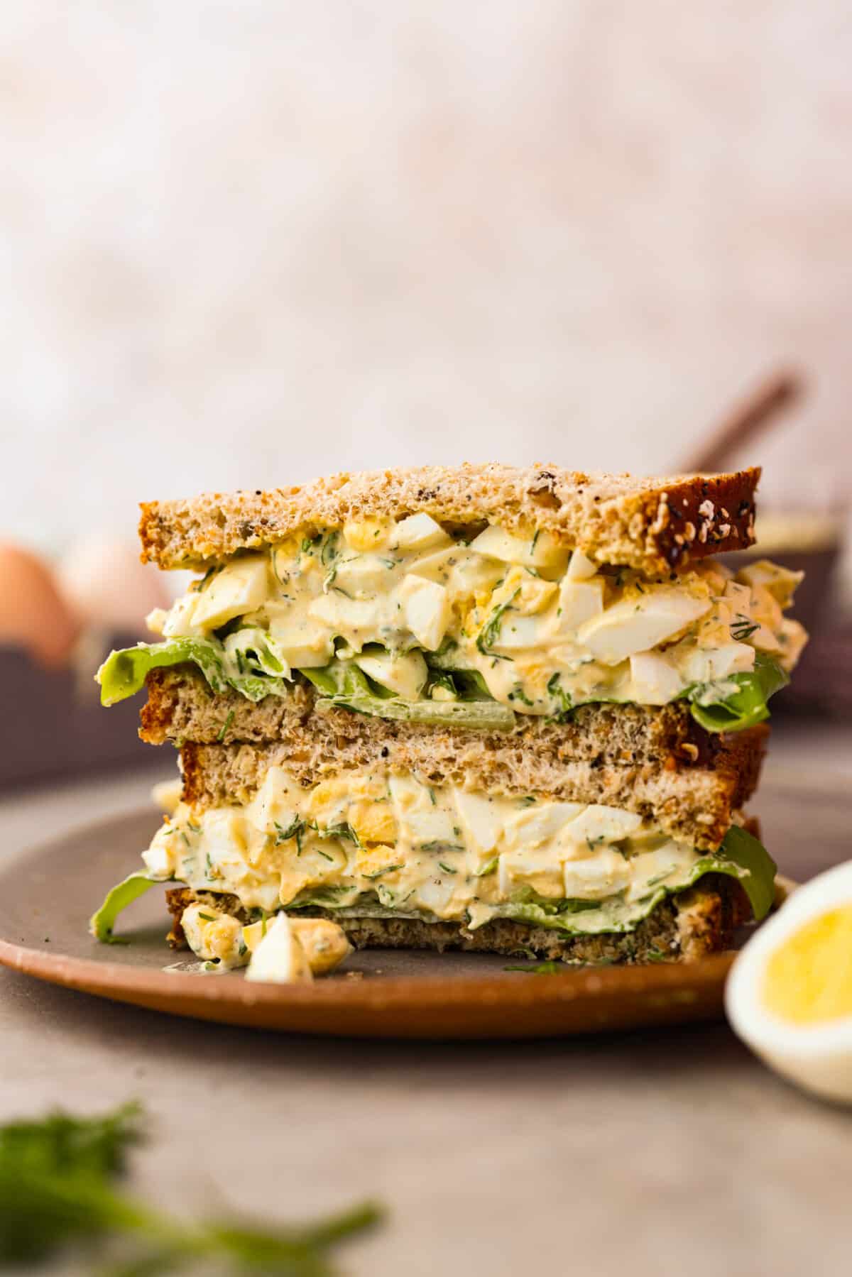 2 slices of an egg salad sandwich.