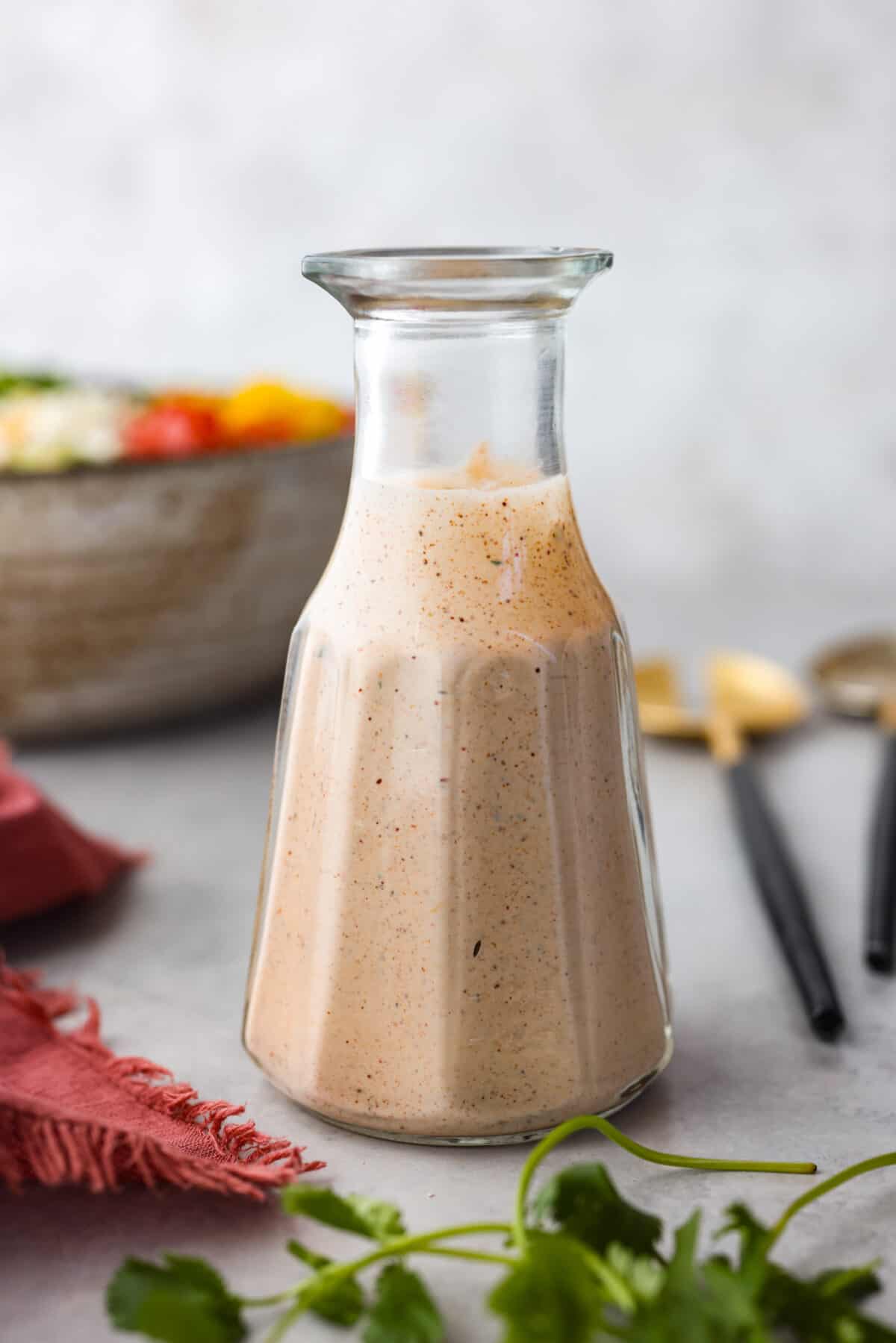 Southwest dressing in a glass serving bottle.