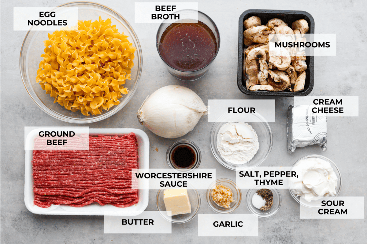 The uncooked pasta, ground beef, and sauce ingredients separated into glass bowls.