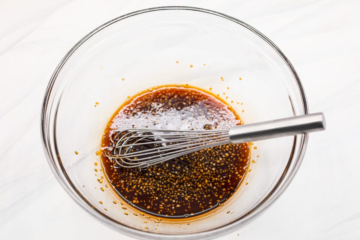 The sauce ingredients being whisked together.