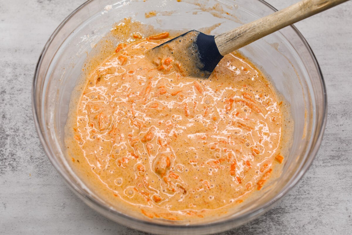 Carrot cake batter in a glass bowl.