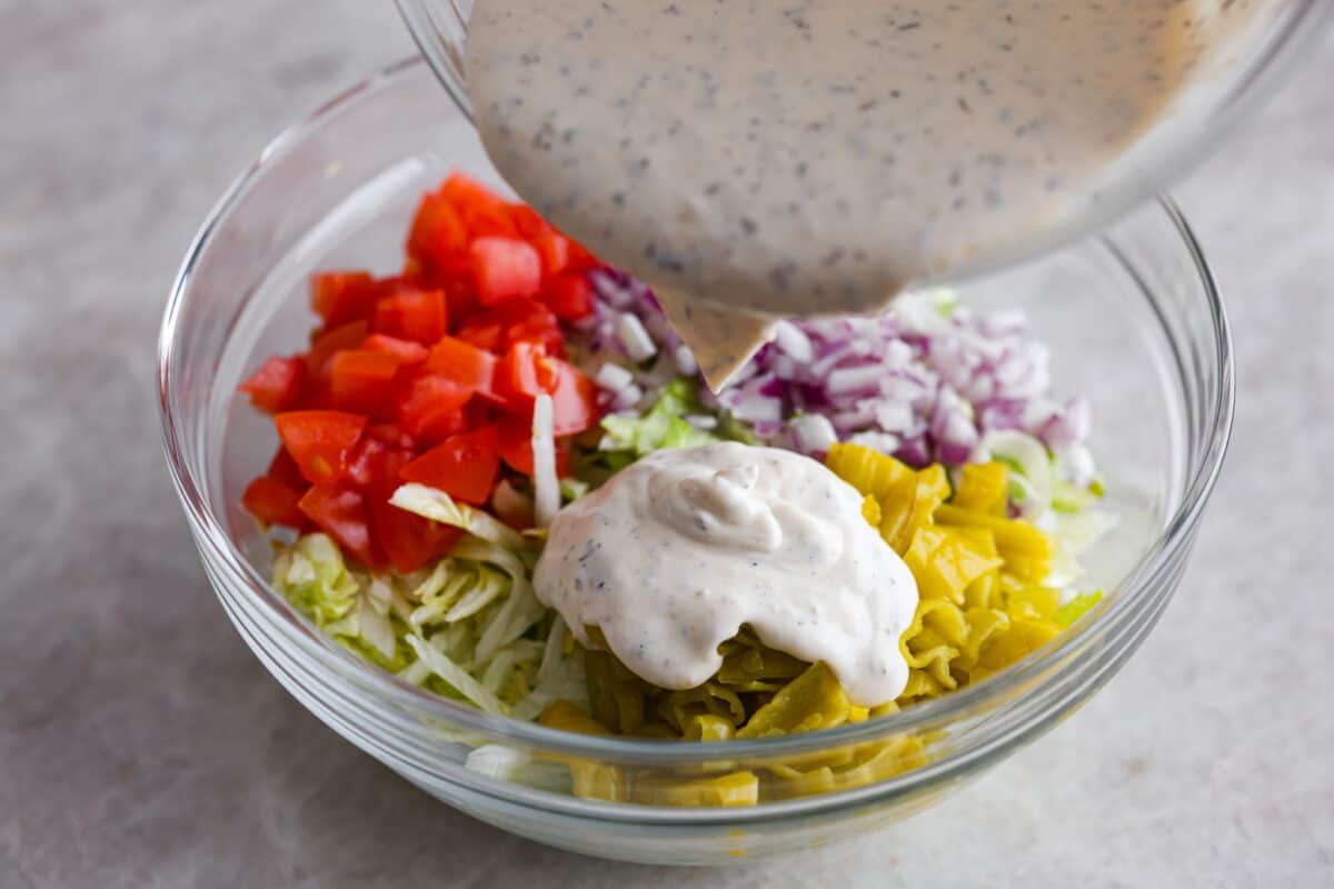 Combining the vegetables and the salad dressing