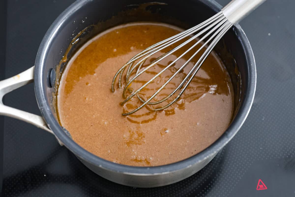 The ham glaze ingredients being whisked together.