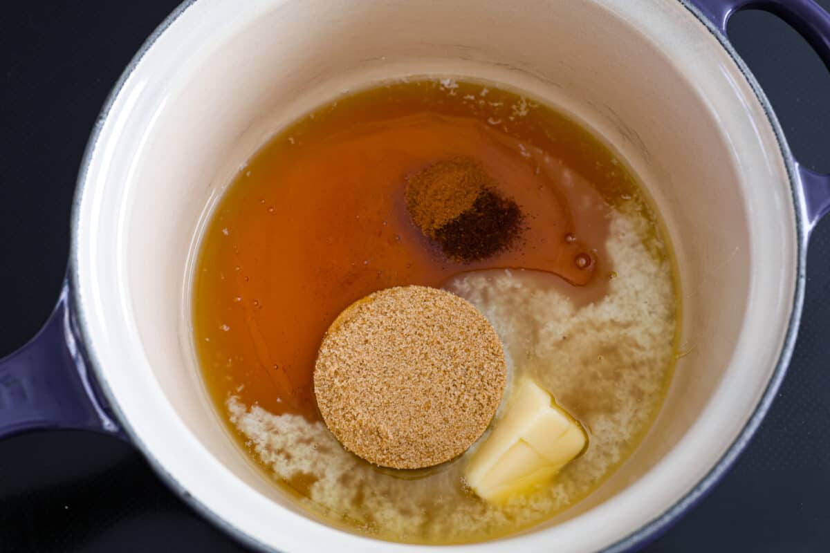 Adding the glaze ingredients to a saucepan.