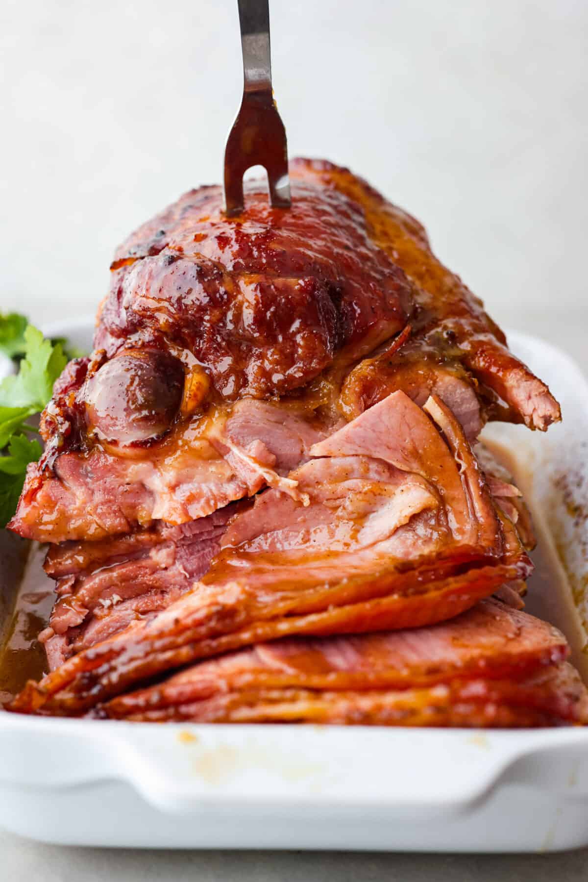 Front view of the ham being cut into slices.