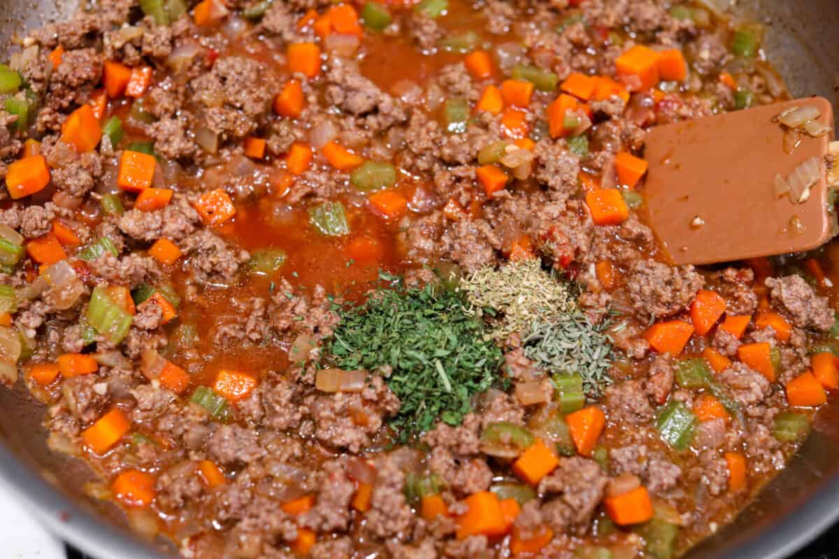 Sauteeing the beef and vegetables.