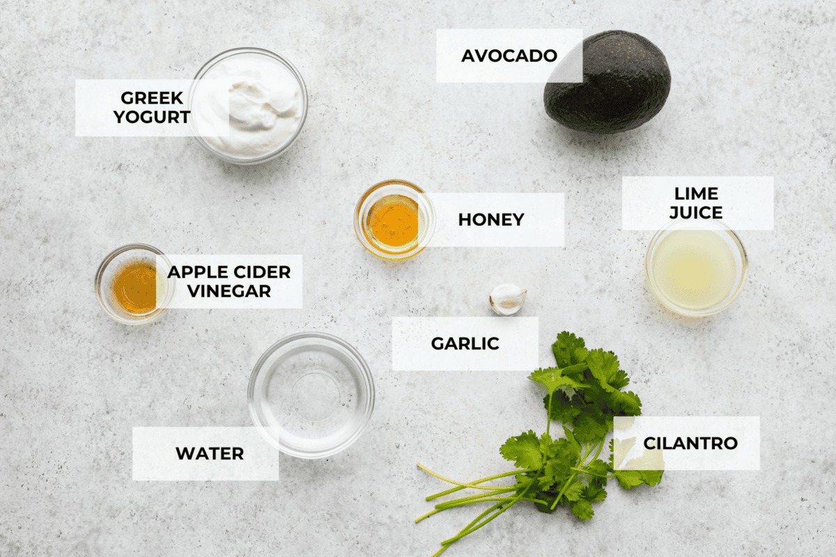 Overhead view of ingredients for in small bowls, labeled. 