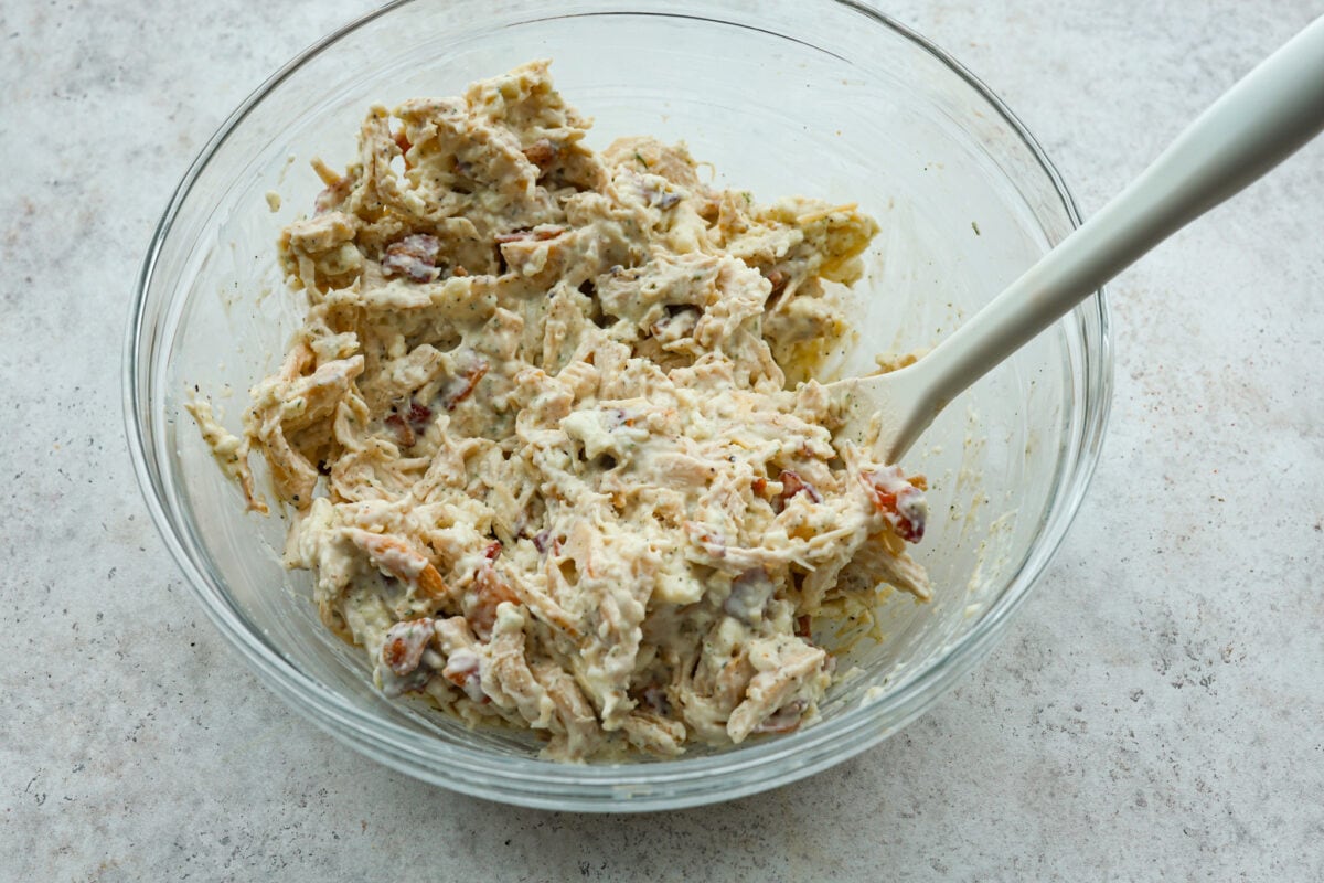 A glass bowl with all of the ingredients combined. 