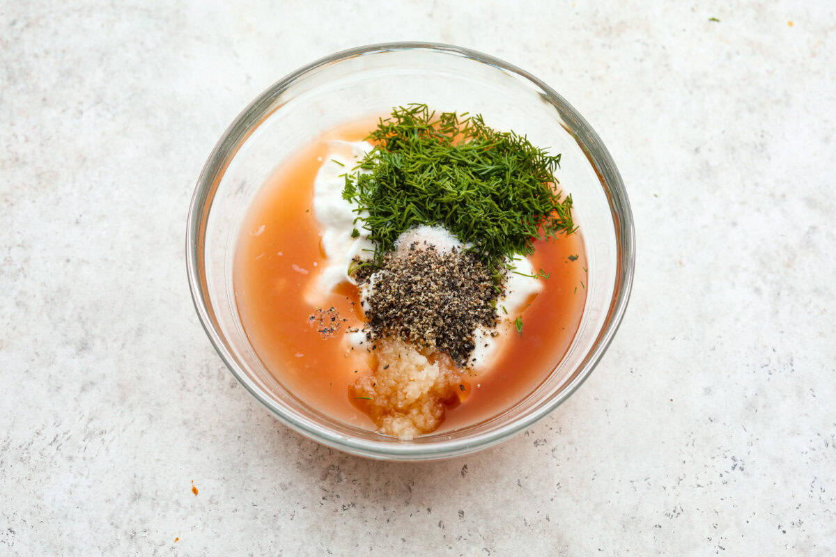 Dressing ingredients in a glass bowl. 