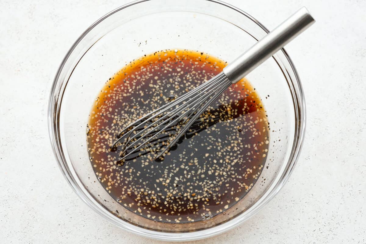 Marinade whisked in a glass bowl. 