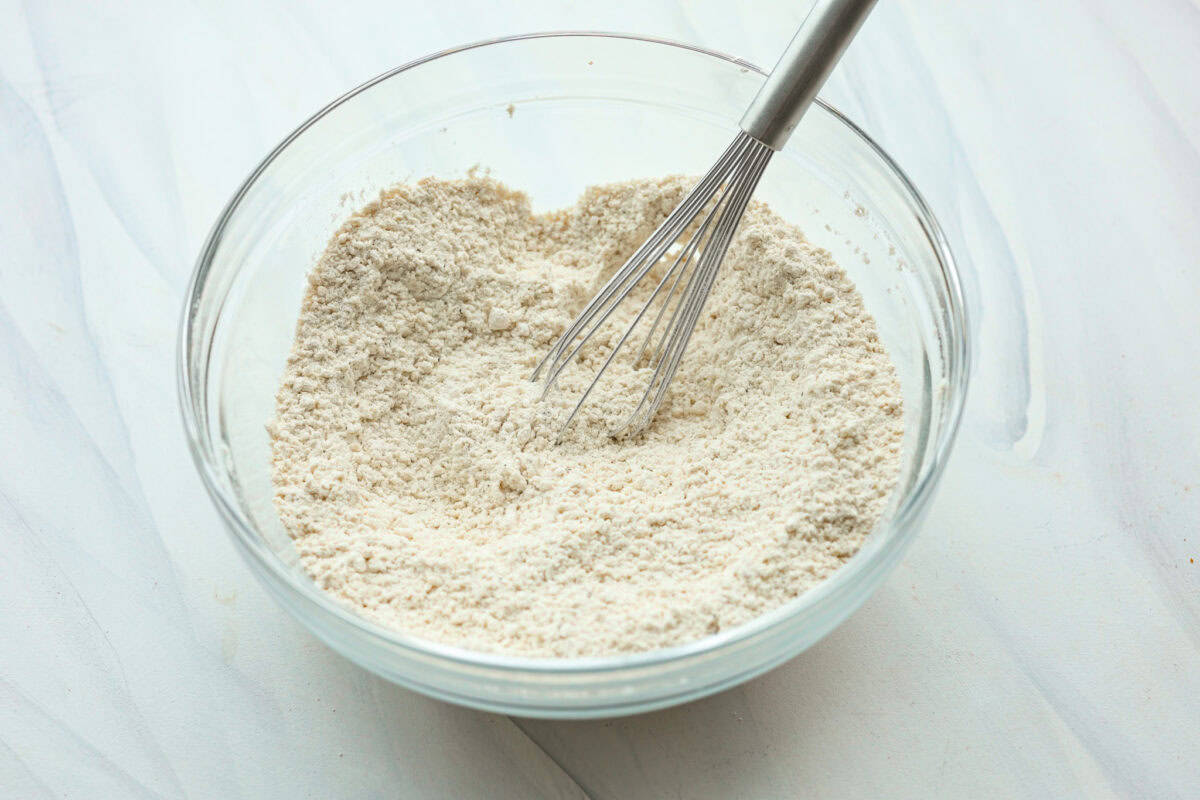 Dry ingredients combined in a glass bowl. 