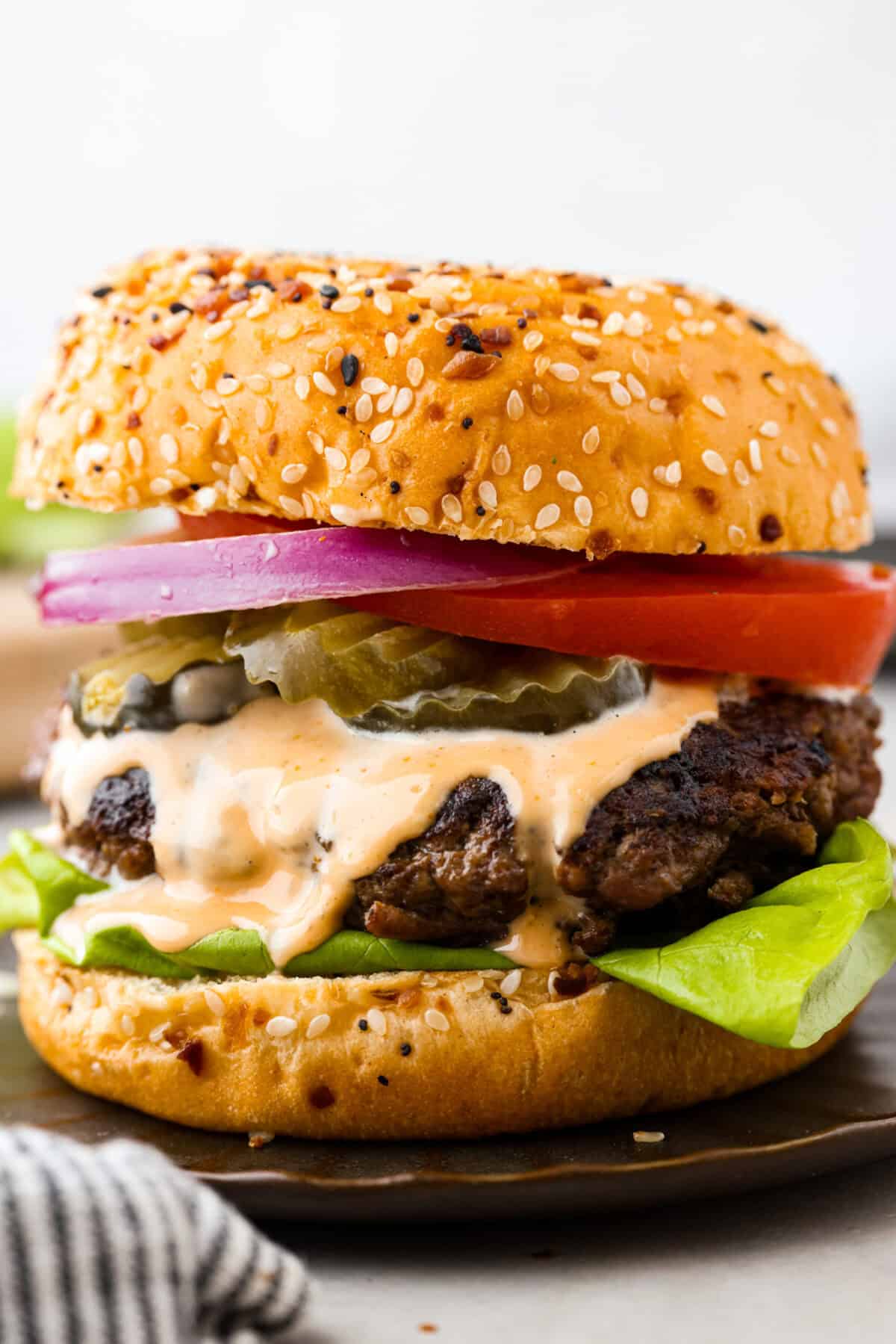 A close up of a burger on a plate. 