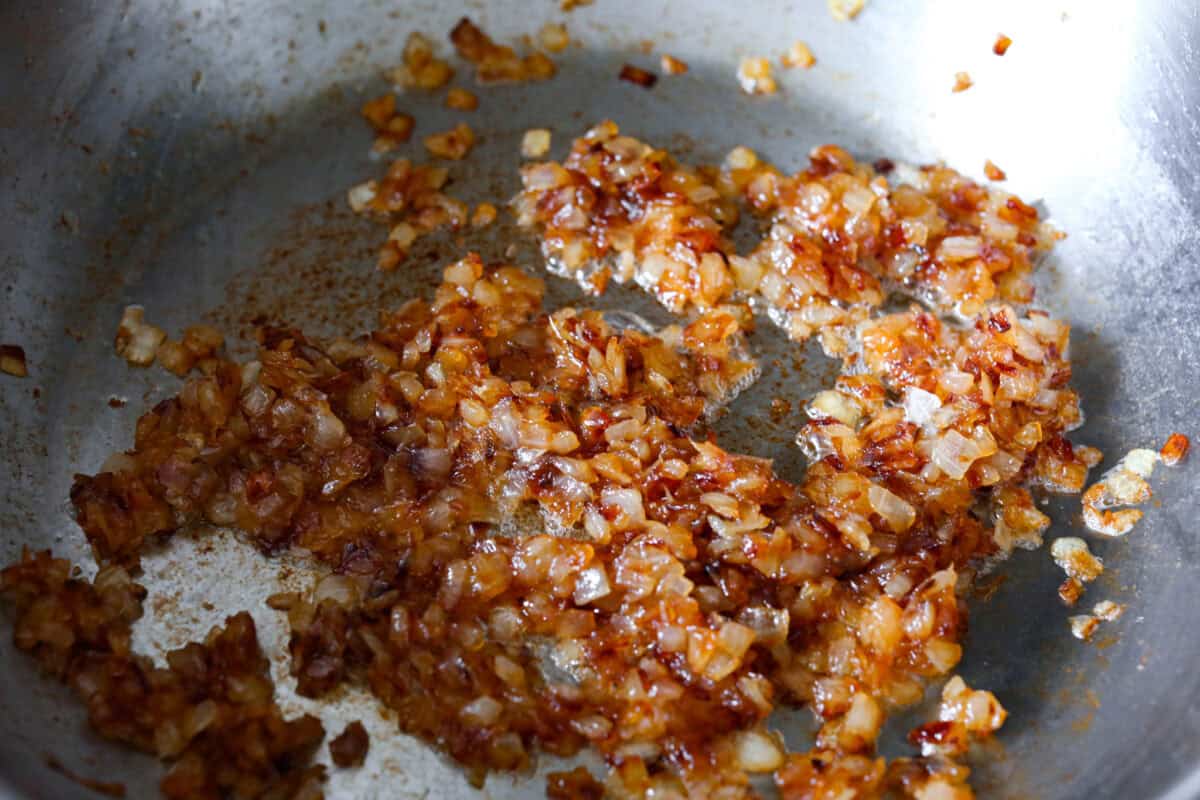 Second photo of caramelized onions in a pan.