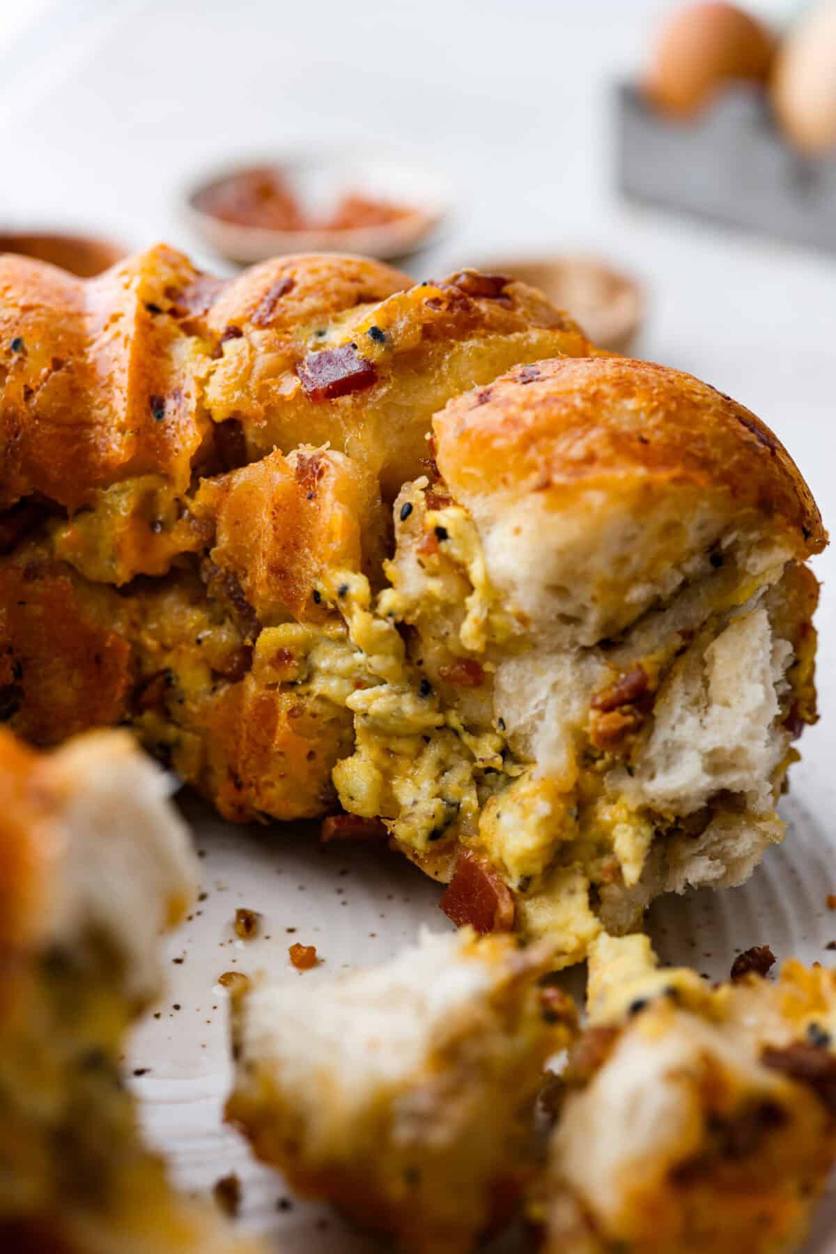 Close up shot of the breakfast monkey bread with piece taken out. 