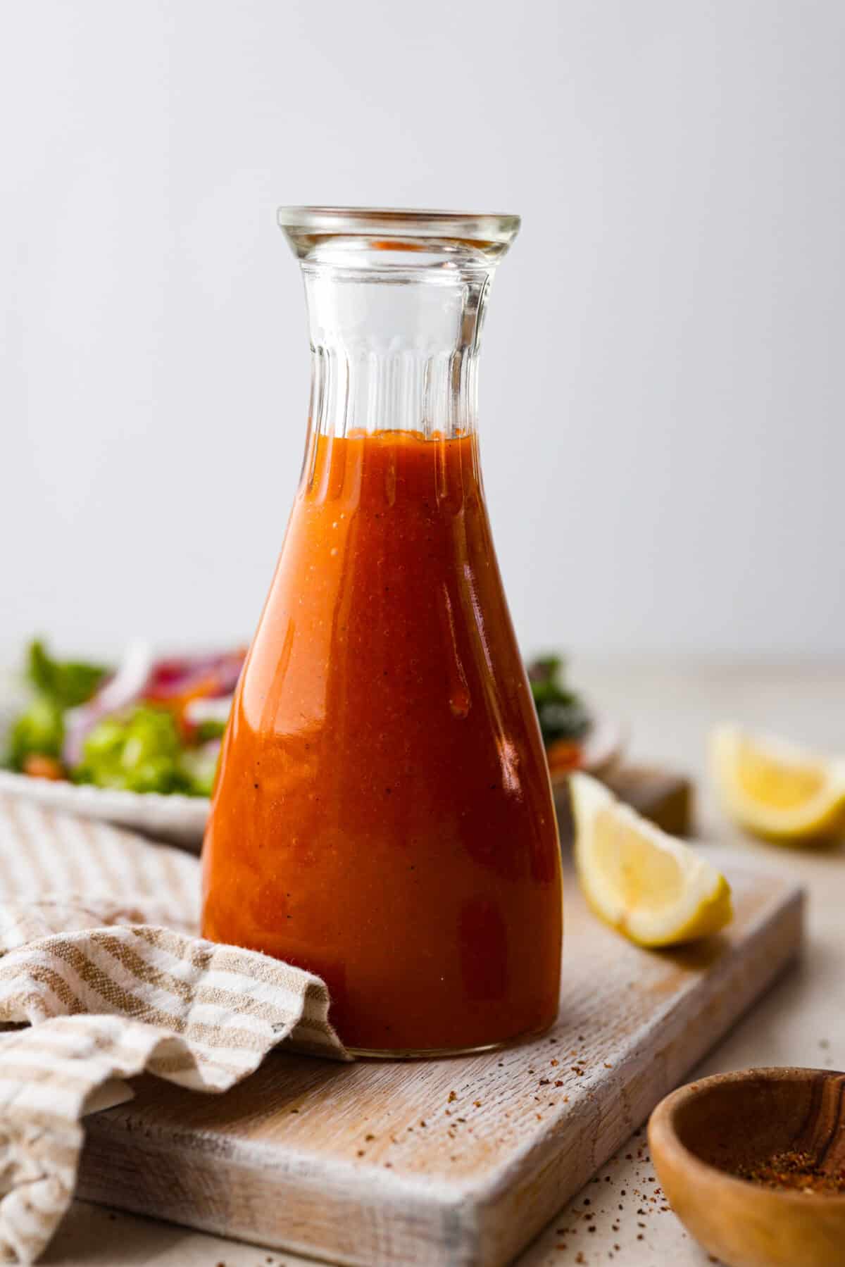 Side shot of Catalina French dressing in a glass bottle. 