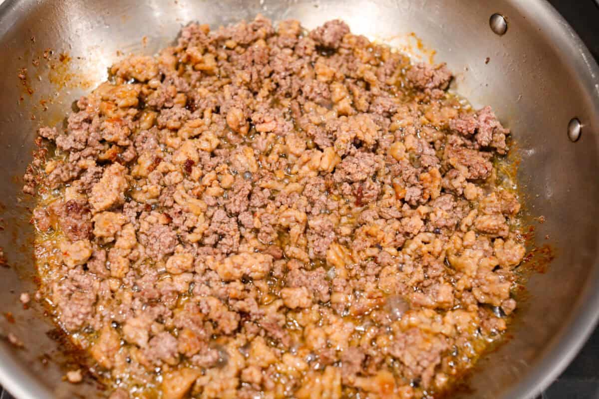 First photo of the meat browning in a pan.