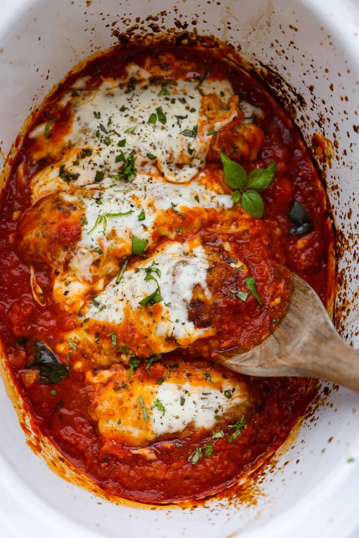 Overhead shot of cooked slow cooker chicken parmesan. 